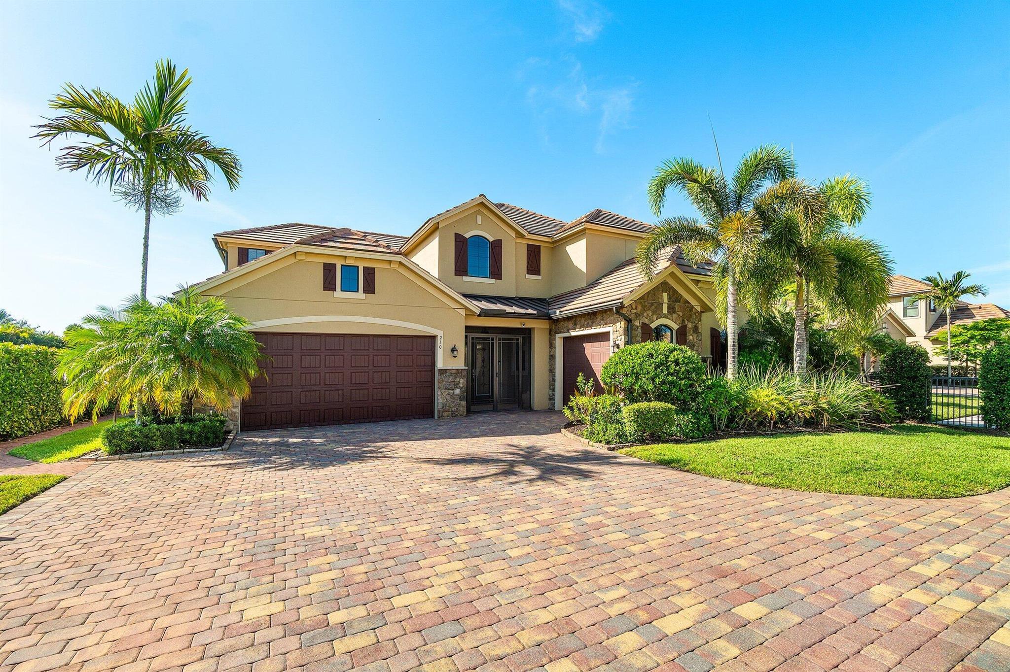 Live in luxury this season and stay in the exclusive gated community of Sonoma Isles located in Jupiter, Florida. Escape to this breathtaking lakefront retreat offering just under 4,500 square feet under air, thoughtfully designed for refined seasonal living. This stunning 4-bedroom, 4.5-bathroom home seamlessly blends coastal elegance with everyday comfort all set in one of Jupiter's most serene and private communities.The expansive open floor plan welcomes you with soaring ceilings, walls of windows, and an abundance of natural light. A chef's dream, the gourmet kitchen features granite countertops, custom cabinetry, a sprawling island, and designer lighting, all opening to a spacious great room and dining area perfect for entertaining or relaxing Step outside through the sliding glass doors to your private pool and covered patio where peaceful lake views and lush tropical landscaping create a resort-style backdrop. Enjoy unmatched privacy with only one adjacent neighbor, offering a true sense of seclusion.

The oversized primary suite offers a luxurious sanctuary with serene views, a spa-like en-suite bath, and walk-in closets. Each additional bedroom includes its own private bath, ideal for hosting family or guests in comfort. Whether you're here to unwind, entertain, or explore all that Jupiter has to offer, this home delivers the perfect blend of sophistication, space, and tranquility.