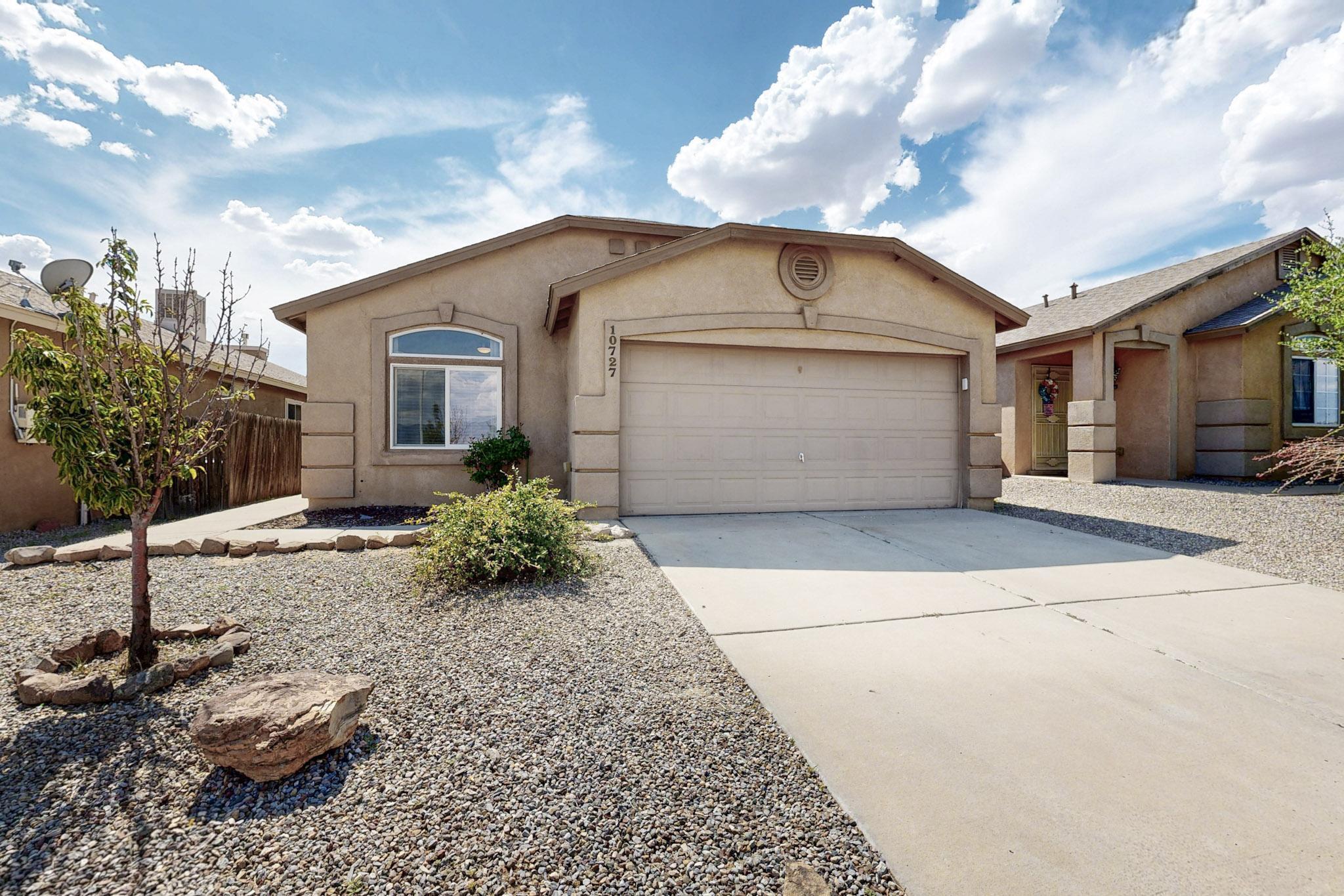Welcome to this charming and light-filled single-story home featuring 4 bedrooms and 2 bathrooms. With vaulted ceilings and stylish plant ledges, the open layout creates a spacious and airy feel throughout. The generous kitchen and dining area include stainless steel appliances--refrigerator, gas range, built-in microwave, and dishwasher--all ready for your next meal or gathering.Enjoy year-round comfort with a newer refrigerated air unit for efficient heating and cooling. Step outside to a private backyard, perfect for relaxing evenings or weekend entertaining. The primary suite offers a peaceful retreat with a walk-in closet, garden tub, separate shower, and dual sinks. Washer and dryer are also included--making this home move-in ready.