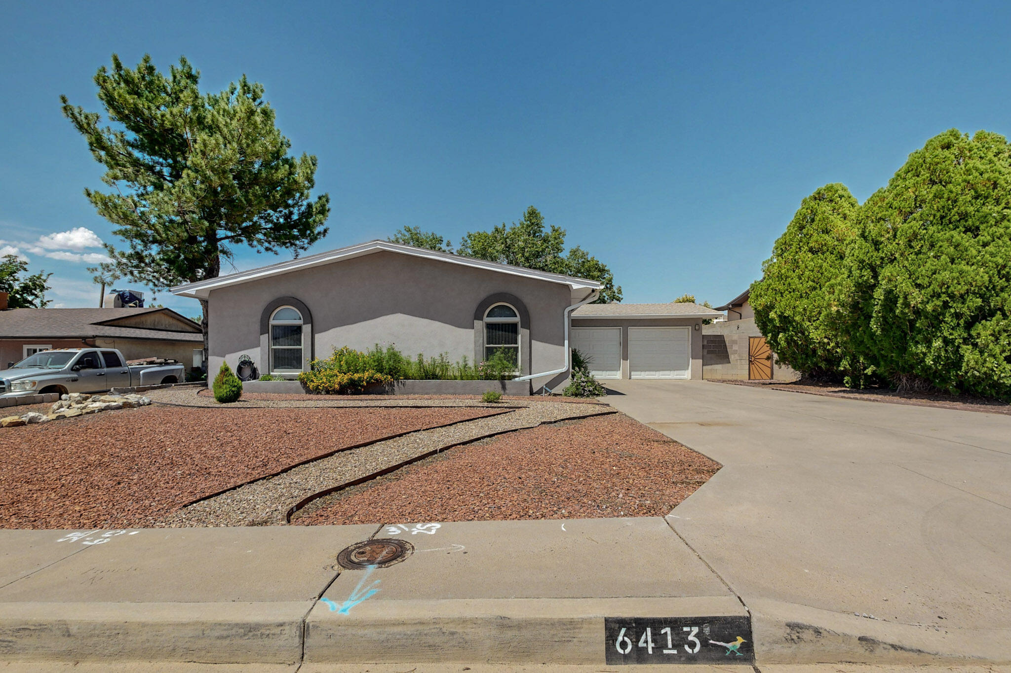 Beautifully updated 3 bedroom (plus office/ 4th bedroom), 2 bathroom with tons of improvements inside & out!  Updated eat-in kitchen with quartz countertops, lovely new back splash, & stainless steel appliances.  Spacious bedrooms & bathrooms with updates!  Large living room with a cozy wood burning fireplace. Fully landscaped back yard -- zero maintenance turf - mature grape vines in fenced  side yard, great for gardening, dog run - storage shed - ready for you to relax/entertain plus raised privacy walls & secure side gate.  Stay cool with  refrigerated  AC, laminate/ tile flooring throughout, new lighting, new modern synthetic stucco, stylish front door. Oversized two car garage with shelving  & a nice long driveway! Close to parks, golf, shopping and dining. This gem is move-in ready!