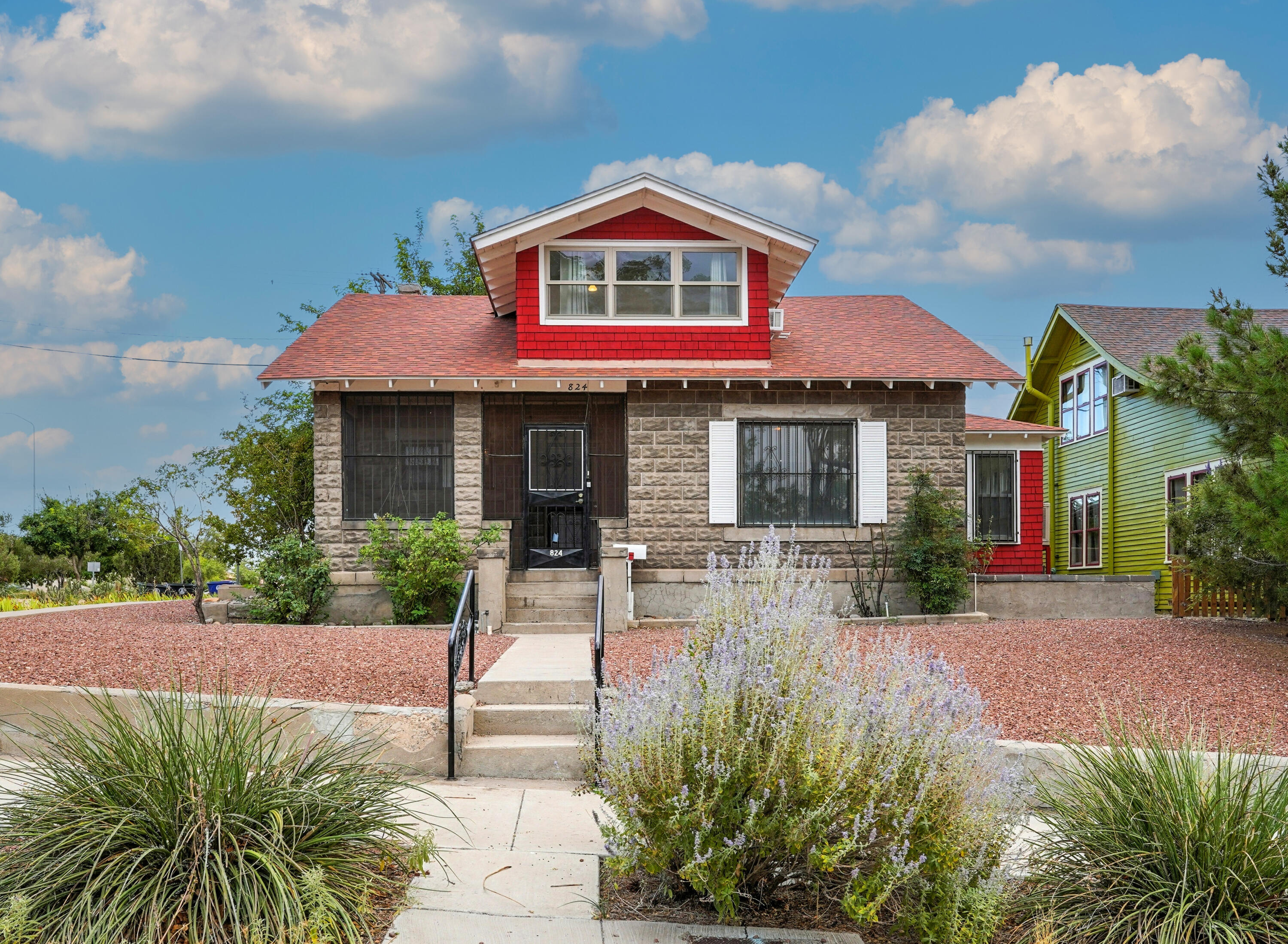 Discover the soul of historic Albuquerque in this captivating Huning Highlands 2 story bungalow! This 4 bedroom gem radiates timeless style and character, from its gorgeous original hardwood floors and crown molding to the stunning natural stone facade. Gather around the cozy fireplace or retreat to the beautifully updated kitchen, featuring sleek quartz countertops, a subway tile backsplash, and a charming breakfast nook.Step into a private paradise in the lush backyard, a verdant haven brimming with vibrant flower gardens, fragrant rose bushes, and towering trees--an entertainer's dream! The home also boasts an updated bathroom, a newer roof, and a huge laundry room with endless storage. An automatic gate leads to a two-car garage and carport. ...Plus, a fantastic basement offers....