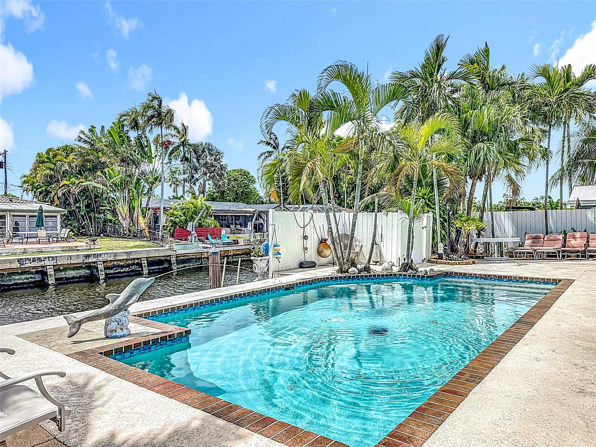 Experience the best of waterfront living in this fully furnished and equipped. 3BR/2BA Annual lease. Pompano Bech home just minutes from the sand and some of South Florida’s most exciting dining destinations. Savor fresh seafood at oceanfront spots, enjoy vibrant tiki bars on the Intracoastal — all just a short drive or boat ride away. At home, relax in your heated pool with serene canal views, or take your small boat or water toys from your private dock straight to the ocean. The spacious patio is perfect for entertaining, your own secluded tropical retreat. Home comes with everything you need simply bring your personal items and start living the ultimate Florida lifestyle. Open to shorter term. Furnished only. Experience the best of waterfront living in this fully furnished 3BR/2BA Annual lease. Pompano Bech home just minutes from the sand and some of South Florida’s most exciting dining destinations. Savor fresh seafood at oceanfront spots, enjoy vibrant tiki bars on the Intracoastal — all just a short drive or boat ride away. At home, relax in your heated pool with serene canal views, or take your small boat or water toys from your private dock straight to the ocean. The spacious patio is perfect for entertaining, your own secluded tropical retreat. Home comes with everything you need simply bring your personal items and start living the ultimate Florida lifestyle.