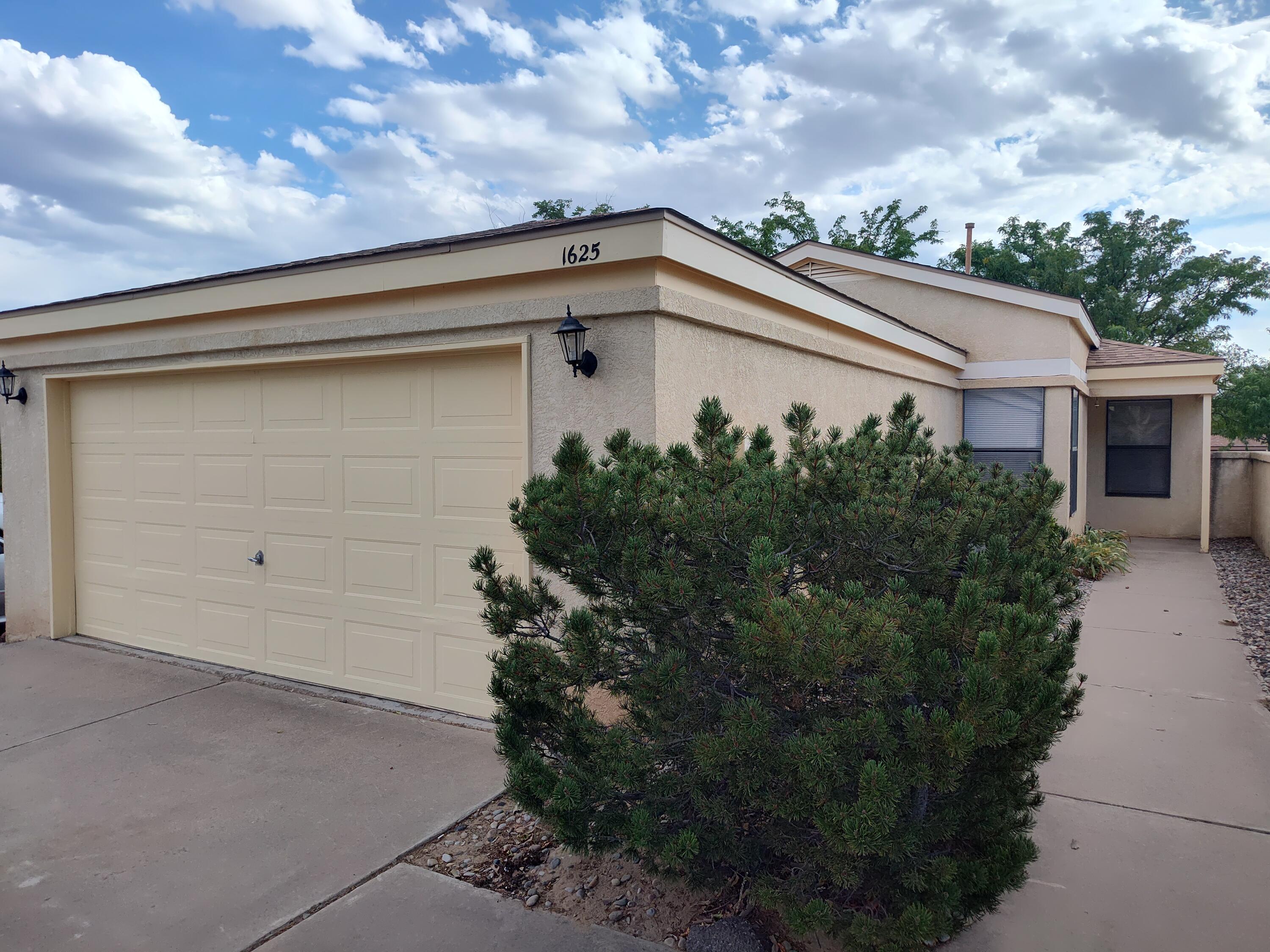 This single-story, open floorplan home is in great condition. There are tile and laminate floorings throughout with carpet in 2 bedrooms.  It has just been freshly painted inside.  The bedrooms are good sized, the primary has a walk-in closet and there is a vaulted ceiling in the main living area.  The furnace, water heater, roof and appliances are newer with built-in microwave and the stainless double door refrigerator stays.  There are no polybutylene pipes!!!   This home is ready to go for one happy buyer!