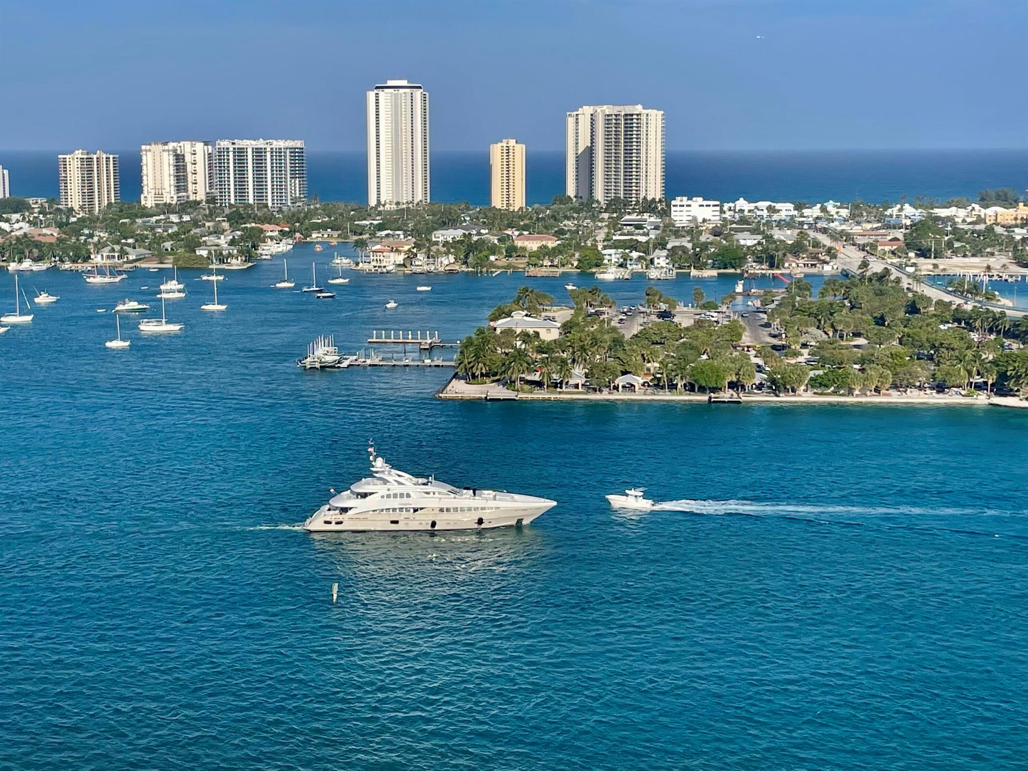 Gorgeous direct, unobstructed views of the Intracoastal Waterway and Atlantic Ocean from this preferred Ocean Tower, 23rd-floor residence at Marina Grande. Enjoy breathtaking sunrises and refreshing ocean breezes from your spacious balcony, living room, and owner's suite. Desirable split floor plan features 2 bedrooms plus a large den--ideal for a home office or 3rd bedroom. The chef's dream kitchen boasts seating for six at the countertop bar, new custom cabinetry, white quartz countertops, a turquoise glass backsplash, and premium Kenmore & KitchenAid stainless steel appliances, including induction cooktop, warming drawer, and convection oven. The owner's suite is a relaxing retreat with dual white custom vanities, a walk-in shower with frameless glass doors, a separate water closet, and his &amp; hers custom closets with additional built-in cabinetry. The guest bath has been fully remodeled with a white vanity, quartz countertop, stone vessel sink, and frameless glass shower doors. Additional highlights include an inside laundry room with added storage and a new sleek LG washer/dryer, full impact glass throughout, newer Bosch HVAC with Reme-Halo, custom interior doors with new casings, upgraded baseboards, and 24"x24" tile flooring throughout (NO carpet). This prestigious residence is offered fully furnished for the perfect turnkey sale. Marina Grande amenities include a heated lap pool, barbecue grills, poolside bar and fireplace, tennis, pickleball, bocce ball, and a waterfront clubhouse hosting community social event.