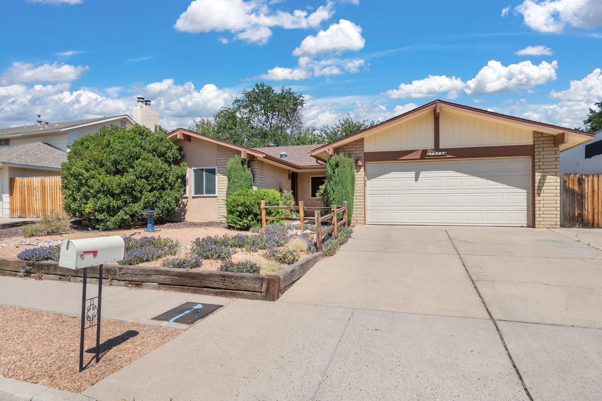Located in the highly sought-after La Cueva School District, this 4-bedroom, 1 3/4 bath home offers both space and functionality in a prime Northeast Heights location. Inside, you'll find two-plus living areas, including a cozy family room with a wood-burning fireplace, perfect for gathering on cool evenings. The formal dining room is ideal for entertaining, while the open-concept kitchen features stainless steel appliances, Corian countertops, a pantry, and direct sightlines to the family room--making it the heart of the home. The layout offers flexibility for families, work-from-home needs, or guests, with four comfortable bedrooms. Step outside to a lush backyard with grass, a covered patio, and plenty of room to relax or play. Playground equipment remains.