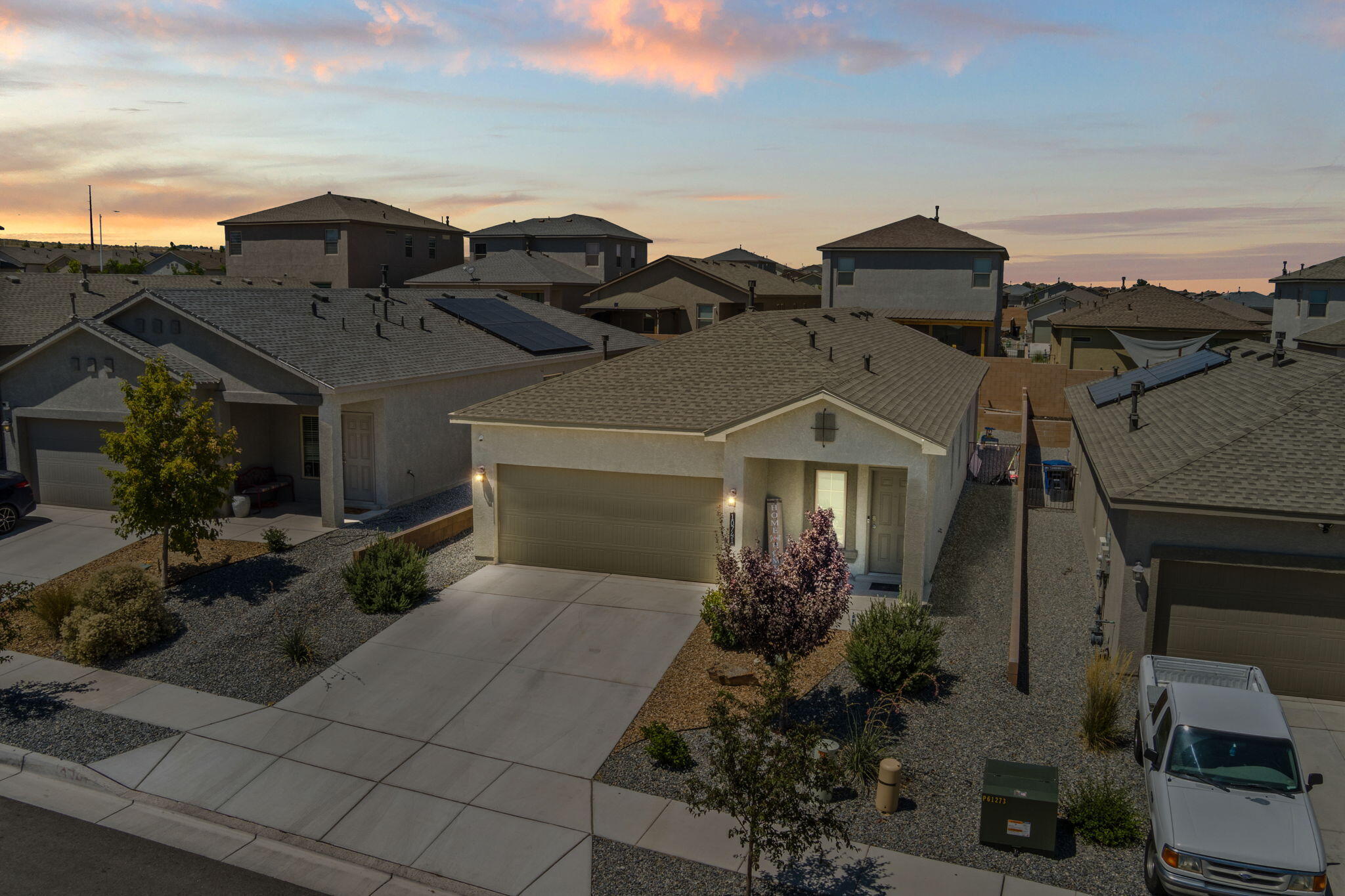 Step into comfort and style with this well-maintained Scarlette floor plan, located in the desirable gated community of Aspire. This thoughtfully designed three-bedroom, two-bath home blends function and flair, offering modern conveniences and energy-saving features throughout. From granite countertops and backsplash, with tile flooring in all wet areas, 9 ft. ceilings and a smart home package. The highlight? A beautifully crafted custom media center and an electric fireplace Wall--an impressive focal point designed with both form and function in mind. Enjoy access to parks, scenic trails, and sweeping views in a vibrant, master-planned community.