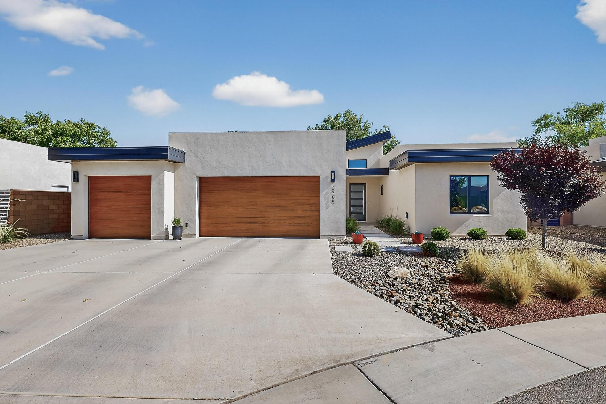 Gorgeous, contemporary home nestled in the coveted, gated community of Bosque Antigua in the North Valley with direct access to the Rio Grande bosque trails. This hard-to-find newer, single-story home with a 3-car garage is a stunner! As a former model home, it has high-end features and finishes throughout, with gorgeous flooring, low e Pella windows, custom cabinetry with quartz counter-tops and smooth finish walls. The open concept floorplan is perfect for entertaining and the views from the widows bring the gorgeous outdoors in. This home has a NM Green Build certification meaning it is energy efficient and built to a much higher standard than required by codes. If you are looking for luxury living without the maintenance of an old home and large lot, this is a fabulous opportunity.