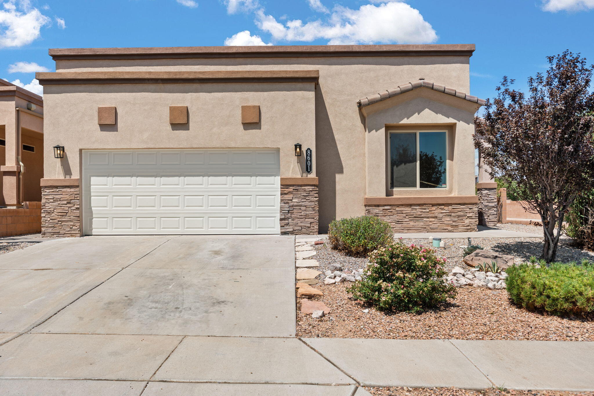 Beautifully updated NW Albuquerque home with bright, open layout and modern finishes throughout. Features include two living areas, a cozy fireplace, and a stunning kitchen with granite countertops,  stainless steel appliances, and a larger island. The spacious primary suite offers a luxurious bath with dual sinks, soaking tub, separate shower, and a walk-in closet with built-ins. Enjoy stylish lighting, fresh paint, and a low-maintenance yard. Close to parks, schools, and main roads. Move-in ready and waiting for you!