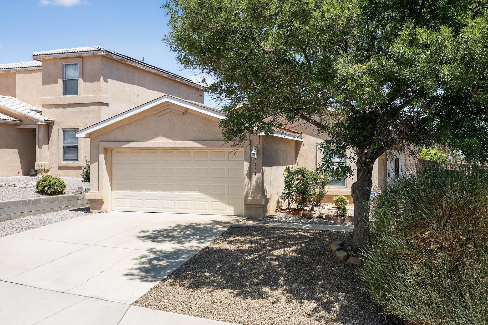 Charming single-story, 3-bedroom home that's move-in ready! This light-filled, open floor plan offers a spacious living area that seamlessly connects to the kitchen, complete with ample counter space, a dining area, and a walk-in utility room for pantry storage and laundry. Large primary suite features a walk-in closet and a beautifully appointed bath with dual sinks, a separate shower, and a relaxing soaking tub. Two additional bedrooms provide plenty of space for family, guests, or a home office. Refrigerated air! Enjoy the low-maintenance landscaped backyard with a deck, storage shed, and sunset and mountain views. Conveniently located near shopping, dining, and just minutes from Paseo for an easy Albuquerque commute.