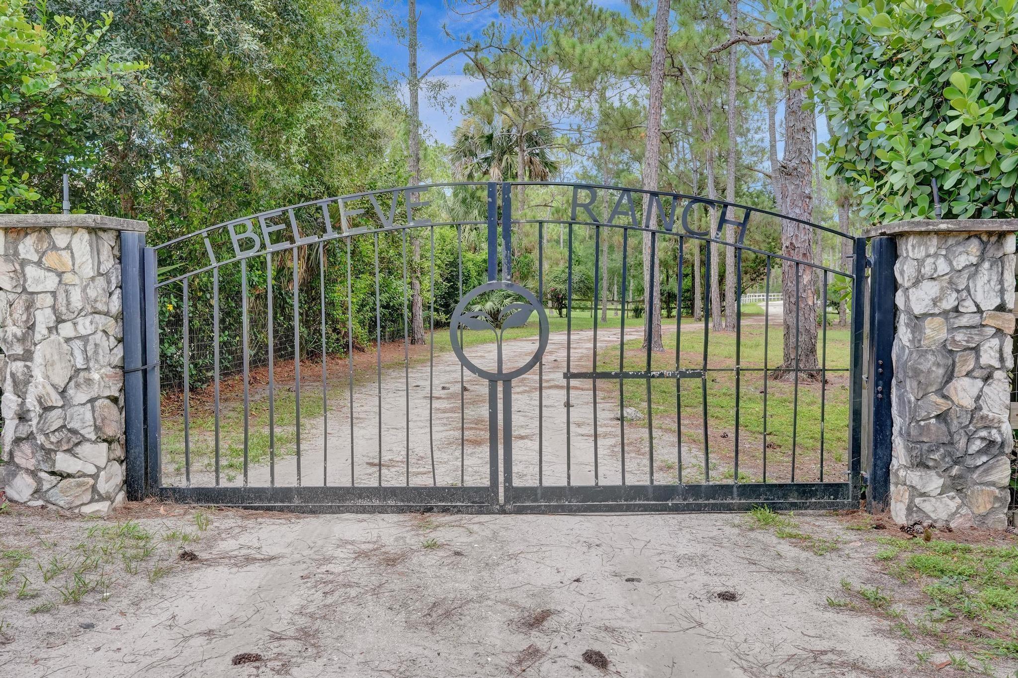 Majestic 10.5 acres offers rare opportunity w/no HOA , Direct access to 30 miles of equestrian and hiking trails, Impeccable 3 bedroom split plan with all new gourmet kitchen,soaring two story ceilings, french doors, fireplace, new contemporary primary bath, luxury vinyl flooring, updated 2ndary baths,wood beam ceilings, breakfast bay window.  A true must-see for country living  close to city. Surrounding the pond is a custom covered Pavilion with bathroom and pizza oven. The property also boasts a workshop with bath,storage garage, chicken coop, exotic fruit trees, bridge to meditation island,gazebo, fire pit, zip line, and electric with pad for another home. A unique and beautiful place to live.