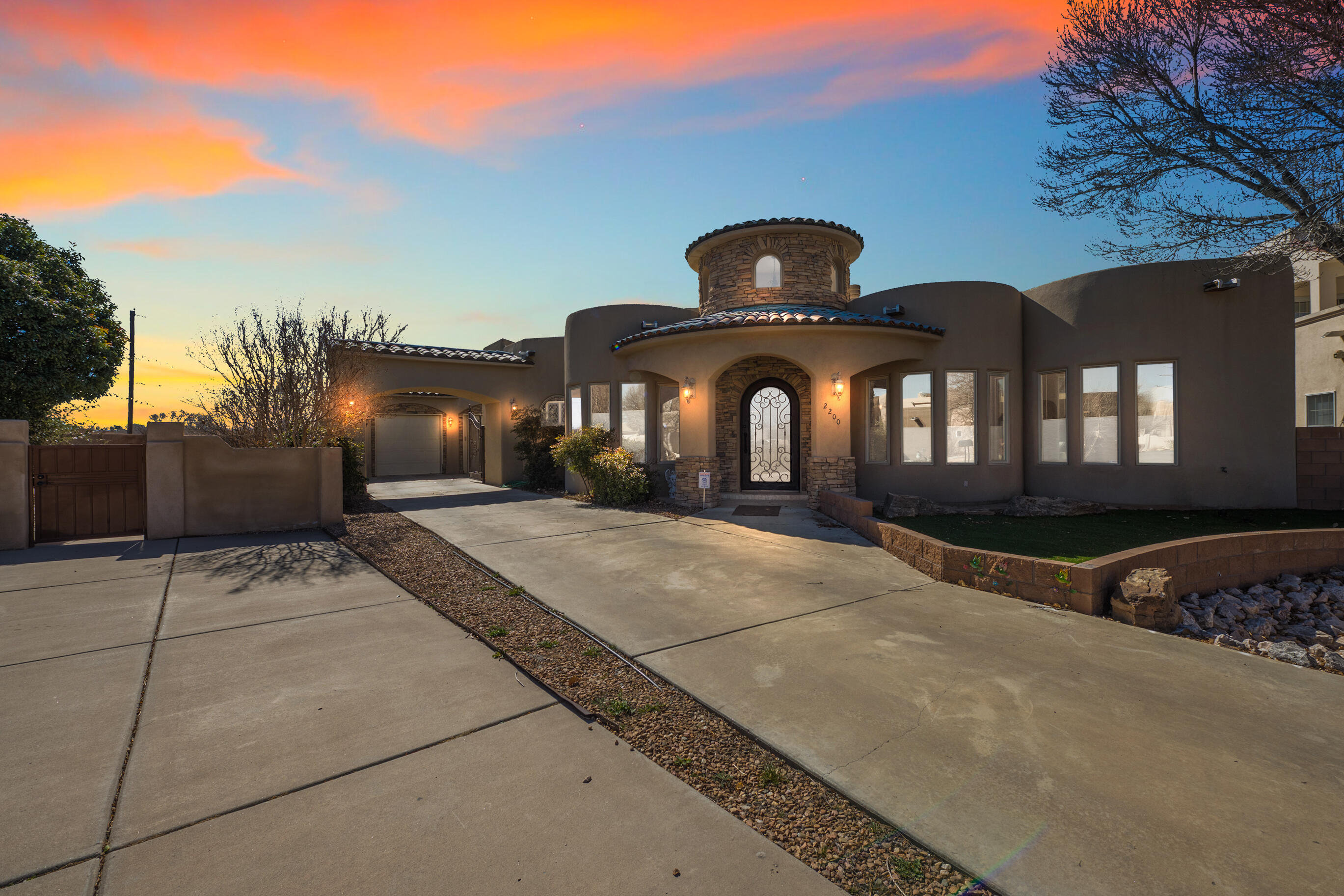 Absolutely stunning Tuscan style home at the Meadows on Rio Grande. Enter this 4/2 through the custom Metal/Glass door.  Admire the entryway with custom tile-work and a huge cupola ceiling. The travertine tiles and beautiful maple hardwood floors, the custom plaster wall finish, and the raised ceilings  makes this a one of a kind beauty.  Wood beams and corbels add to the grand design and emphasize the magnificent custom fireplace.The chef's kitchen has convection oven, custom vent-hood, 6 range gas cooktop, beautiful mosaics, a warming drawer and and huge granite bar.Both baths have  custom vanities.  The primary has a walk in shower, double sinks and a jetted tub.The backyard patio is perfect for quiet nights and the charming neighborhood is near Bosque with great walking trails