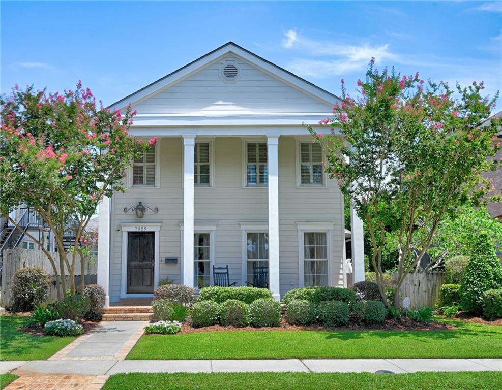 Step into Southern Charm with this Stunning Greek Revival home! Enjoy hardwood floors throughout, including unique reclaimed wood floors. This beauty boasts two staircases, a living room featuring a fabulous two-sided fireplace with soaring ceilings, and a versatile bonus playroom/office downstairs. 

The expansive, updated kitchen is a chef's dream with Taj Mahal quartzite counters and a wet bar, perfect for entertaining. Upstairs, discover four bedrooms, including a gorgeous primary suite flooded with natural light, spa like bath and a private balcony. 

An extra-deep lot offers ample space for a future pool, complemented by convenient rear yard entry, a covered carport, and a storage room. Don't miss your chance to own this architectural gem!