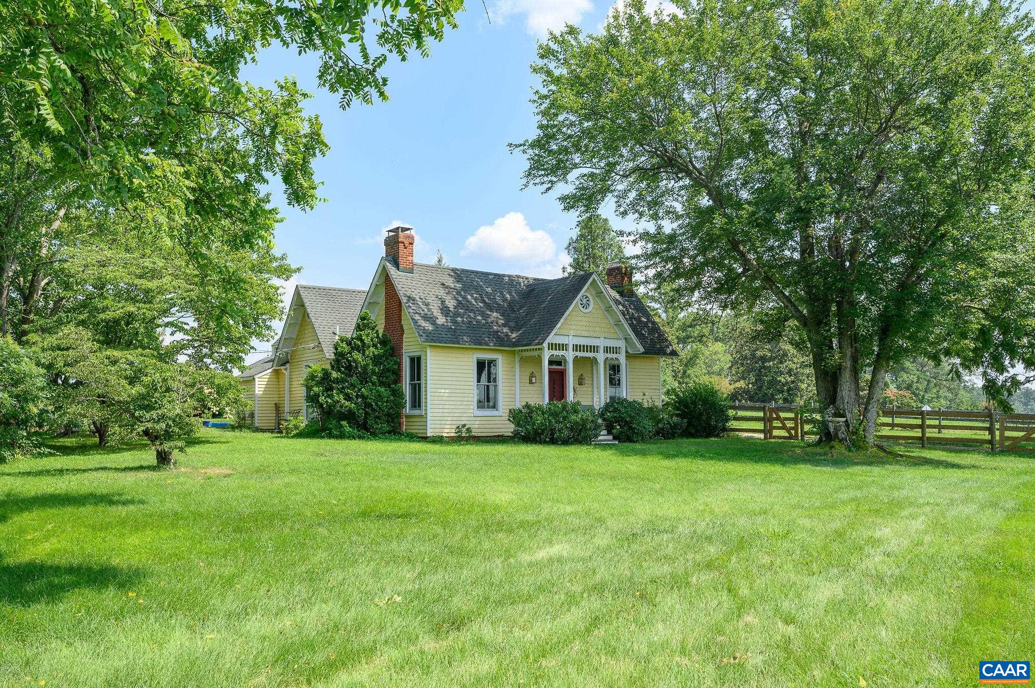 Absolutely charming circa 1856 2-bedroom, 2-bath cottage set on a tidy, manageable one-acre parcel just outside the historic town of Scottsville.  Surrounded by rolling pastures and peaceful countryside, the property offers uninterrupted pastoral views with incredible sunsets that create a truly serene sense of escape. A large maple tree graces the front of the cottage, providing a lovely canopy of shade and timeless character. Glorious white hydrangeas, when in full bloom, add a burst of brightness and classic charm. Thoughtfully maintained and full of character, the home features bright, inviting living spaces and comfortable proportions. Whether you’re relaxing on the front porch or hosting a cozy gathering indoors, you’ll feel right at home in this warm and welcoming setting. The parcel is fenced for dogs and offers room to garden, play, or enjoy the fresh air and quiet. It’s an ideal spot for those who crave a touch of rural living without sacrificing convenience: downtown Scottsville, the James River, and local wineries are all just a short drive away. A perfect artist's retreat, full-time residence, or weekend getaway, this delightful property offers country charm and simple living at its best.