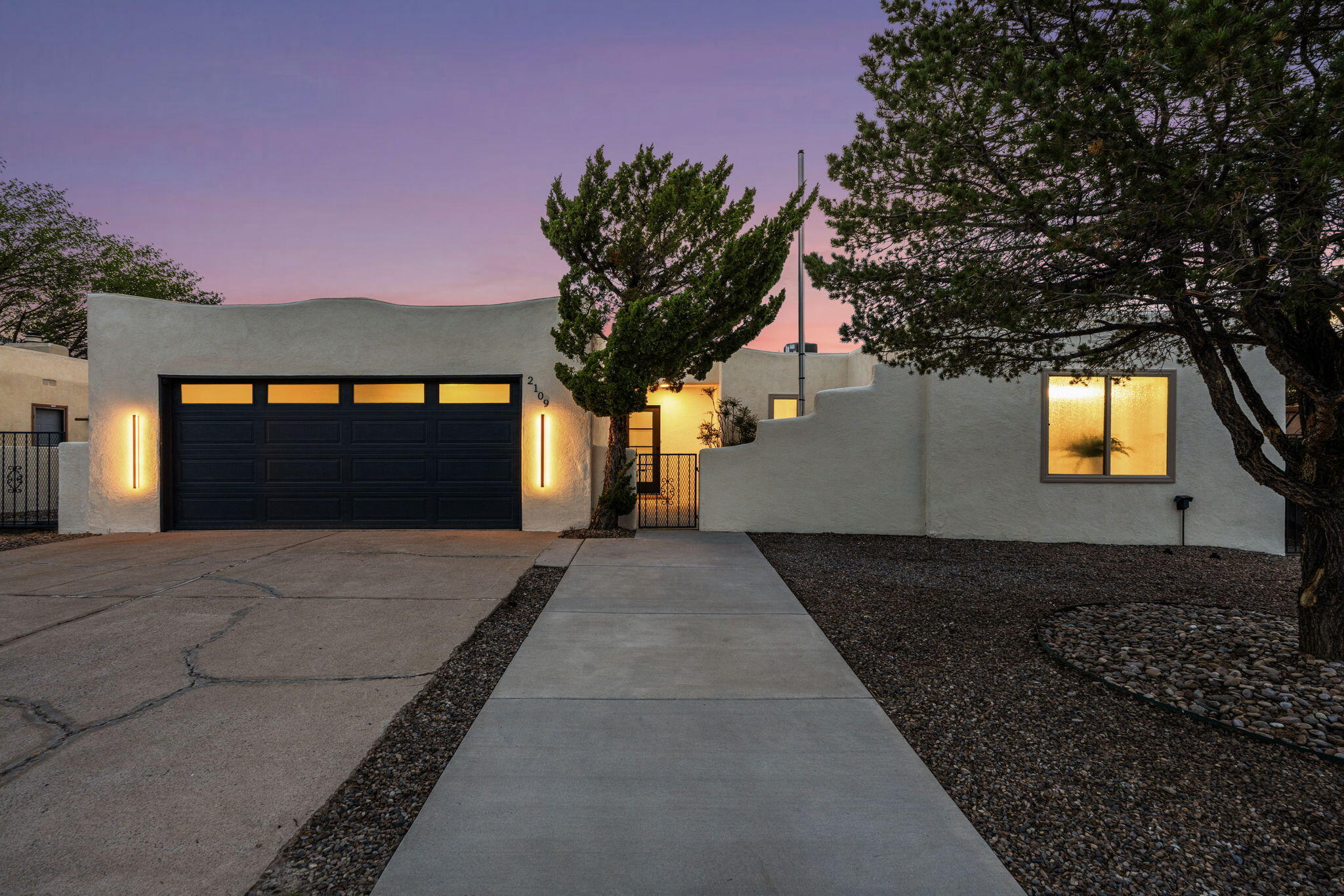Sandia Foothills remodeled beauty with VIEWS and a large inground POOL! Step into this exceptionally spacious home featuring two master suites, multiple living spaces, and a dream kitchen with all new appliances, custom cabinets, and stunning countertops. The primary master suite includes a stand-alone tub and large shower with custom glass surround.  New TPO roof, New refrigerated air system, New tankless water heater, Replastered and updated pool, New Tile flooring, New garage door, fresh paint, and much more! Enjoy unobstructed spectacular views of the sunset year-round from the new Low E custom large windows. A grand sliding glass door makes for great indoor/outdoor living. Located in a sought-out neighborhood and minutes away from Sandia hiking and biking trails. Welcome home!