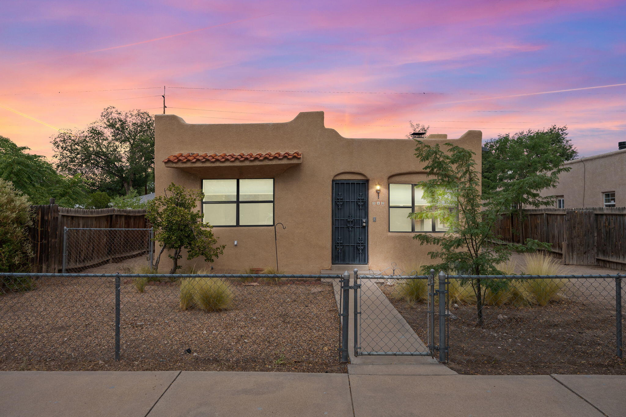 Welcome to this adorable home that boasts a blend of historic charm and modern conveniences. Featuring 3 spacious bedrooms filled with natural light, 2 baths, a cozy living area with wood-burning fireplace, and a delightful kitchen with generous amount of cabinets and countertops. The Casita at the back with its own bathroom & kitchen, charming brick floorings, can be an in-law/guest house or for rental use. Located near vibrant local shops, restaurants, and cultural attractions, this home offers an unbeatable urban lifestyle. Don't miss your chance to own this gem! Schedule your private showing today!