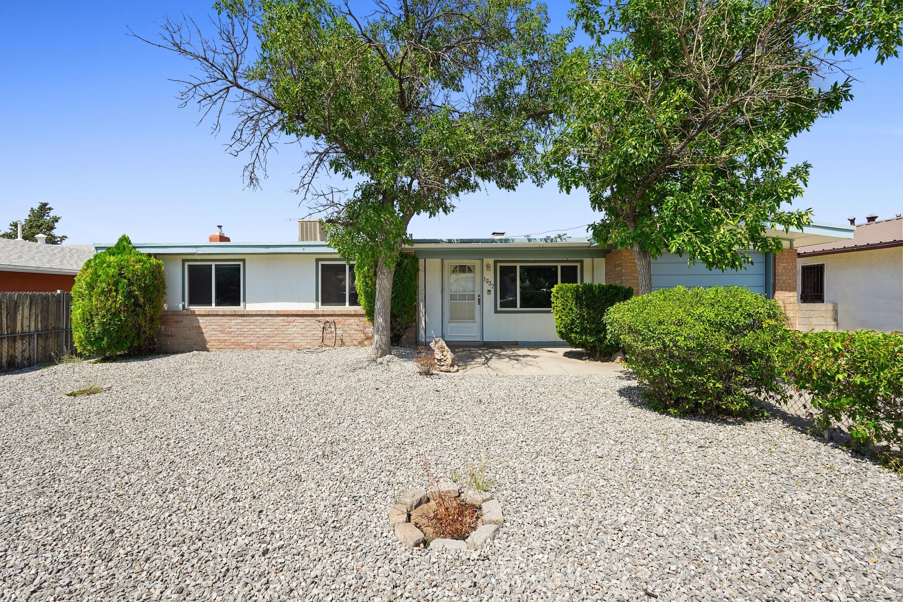 A wonderful home, nestled in the foothills of the Sandias, just minutes away from all the hiking and biking trails you could want. Come see this three-bedroom 2-bathroom, 1,214 square foot home, with easy access to I40, Kirtland, and Sandia Labs. The home has plenty of storage, a fully equipped kitchen, a wood burning fireplace, one car garage with a workshop to accommodate your favorite hobby; and a low maintenance xeriscape front yard for easy maintenance.  The back yard has plenty of space to expand a patio, plant a garden, or accommodate all your entertaining needs.  A large storage barn also lets you store all those gardening tools and extras as well.  Up to 1% of loan amount in buyer's assistance available with the use of preferred lender, eligible for Closing Costs or Rate Buy-Down