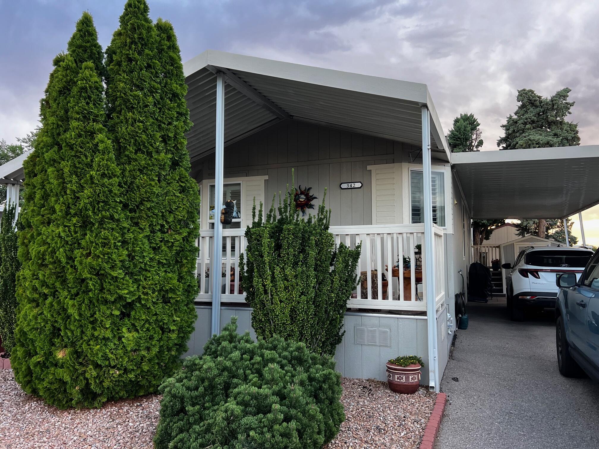 Welcome to this beautifully maintained manufactured home, featuring 2 beds, 2 full baths & a community chock full of activities for those 55+ residents. This home features stunning plantation shutters in the dining & kitchen, archways, wrap around covered deck, small animal friendly, dog run, Tuffshed, security doors, motion lights, bidet in primary, storage, 5 blade ceiling fans & neighborhood watch patrol as well as a host of additional community features like a pool, clubhouse, library, art room, gym, & an extensive neighborhood newsletter loaded with activities & gatherings for the residents. This home has it all for active retirees! Home has some furniture pieces that are available as well as the golf cart for making a run to the clubhouse for an evening of Bingo for an additional $