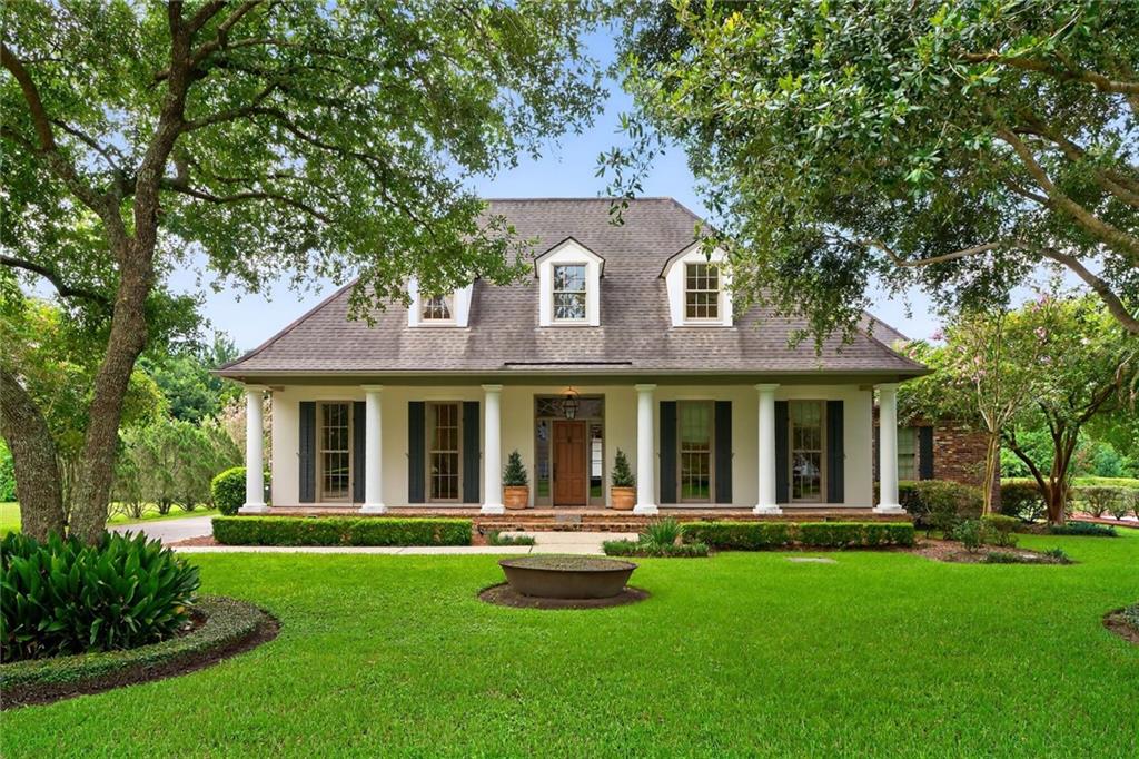 Inspired by the timeless elegance of A. Hays Town, this exquisite home effortlessly blends grace, warmth, and exceptional craftsmanship. From the moment you step into the grand two-story entry with soaring 11-foot ceilings, it’s clear that no detail has been overlooked. The 4-bedroom, 3.5-bath main residence is complemented by a separate 1-bedroom, 1-bath guesthouse—ideal for visitors or private accommodations. Every feature of this home reflects thoughtful design, from the individually hand-selected bricks in the kitchen and breakfast room flooring to the seamless indoor-outdoor flow that makes entertaining a dream. The expansive first floor offers a generous living area, chef’s kitchen with stainless steel appliances, formal living room with fireplace, dining area, and a luxurious primary suite featuring a marble-clad bathroom and classic clawfoot soaking tub. Upstairs, you’ll find three additional bedrooms, each with oversized walk-in closets, and two well-appointed bathrooms. Step outside into a private courtyard sanctuary, complete with a serene pool (re-plastered in 2024), beautifully landscaped grounds, and the architectural details that define Southern charm—exposed beams, vintage brick, wood-paneled ceilings, louvered walls, and flickering gas lanterns. Additional highlights include a two-car garage with ample built-in storage and a newly replaced roof (August 2025). This home is more than a place to live—it’s a lifestyle. Schedule your private showing today to fully experience the charm and craftsmanship this property offers.