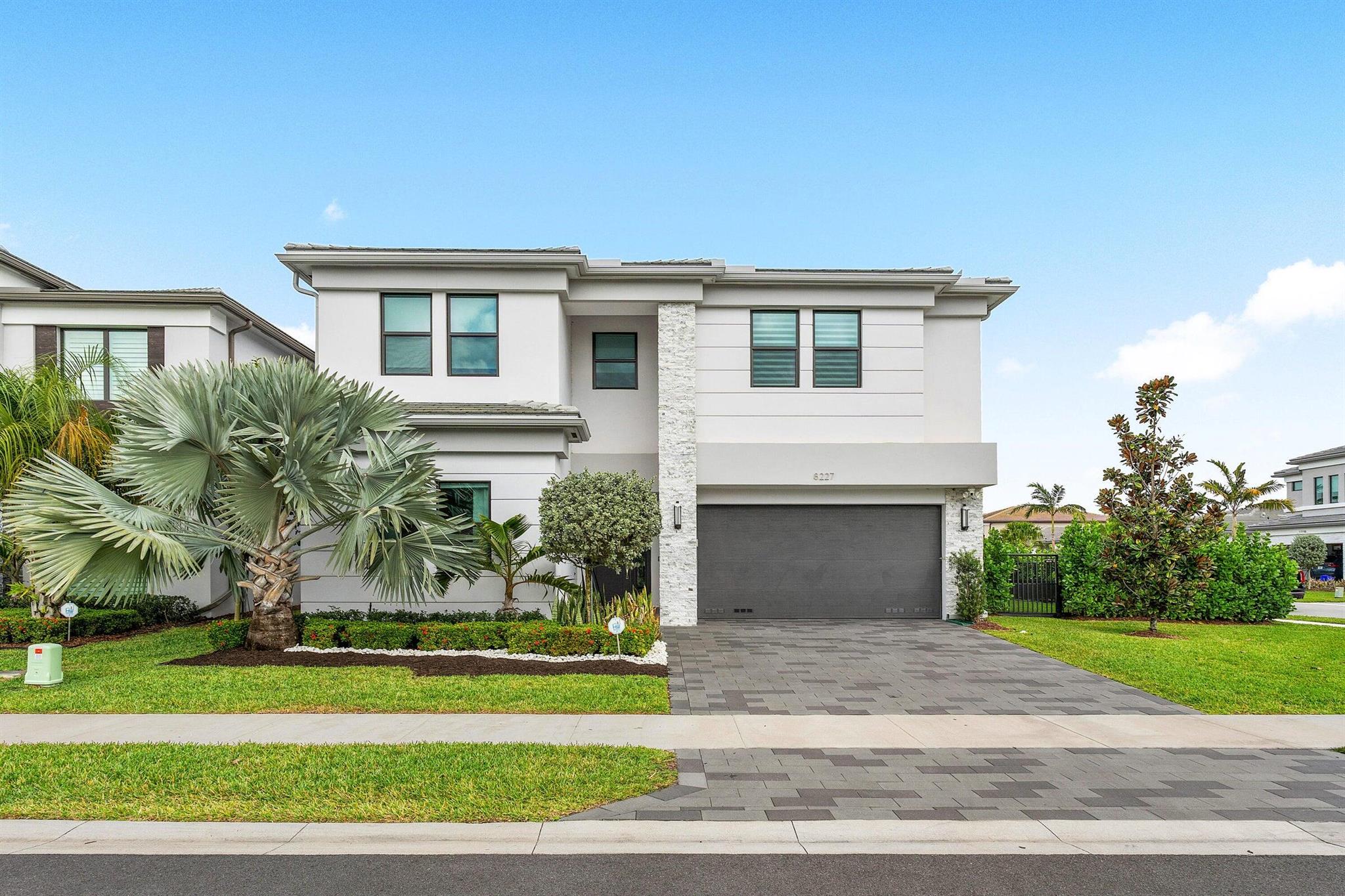 Boca Raton Luxury Home - Lake & Pool Views in Gated CommunityExperience luxury living in this 5-bedroom, 4-bath estate in one of Boca Raton's most exclusive gated communities. Features include:Main-level master suite for comfort & privacyChef's kitchen with stainless steel appliancesBright living room with pool & lake viewsHome gym + large private officeThree-car garage with EV charging stationEnjoy five-star amenities: heated resort-style pool, full fitness center with classes, award-winning tennis courts, playgrounds, clubhouse, and on-site restaurant.&#128205; Prime location near top-rated schools, upscale shopping, and pristine beaches.This lakefront Boca Raton dream home offers elegance, comfort, and a resort lifestyle all in one.
