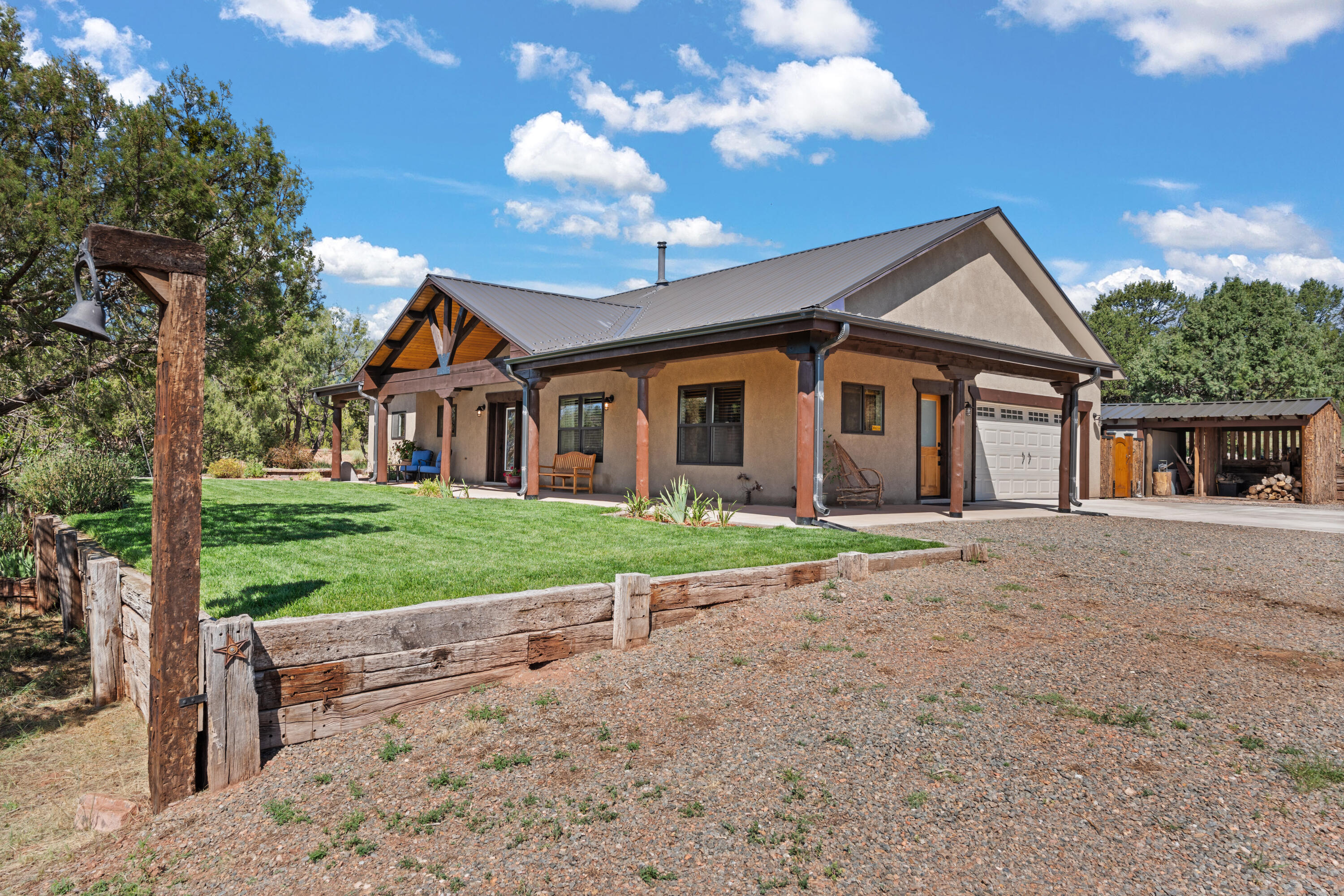 Welcome to this one-of-a-kind custom-built mountain retreat in an exclusive gated community of just four homes--with no HOA. Perfectly situated only 10 minutes from I-40, this property offers the ultimate blend of privacy, convenience, and luxury. The gated and fully fenced acreage--complete with cross fencing--makes it ideal for horses. Inside, every detail speaks of quality, from the cherry wood custom cabinetry and quartz countertops to the striking custom concrete island. The primary bedroom features a gorgeous blue-stain pine ceiling, while abundant storage, including attic space, ensures everything has its place. Heated bathroom floors add a touch of everyday indulgence, and craftsmanship shines in every room with high-end finishes throughout. Low utility costs adds to the charm.