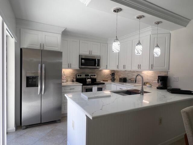 YOUR TROPICAL PARADISE AWAIT YOU! NEWLY RENOVATD KITCHEN & MASTER BATH WITH ALL THE MODERN UPGRADES, ALL NEW FURNITURE, KING- SIZE BED IN MASTER & TWINS IN GUEST ROOM.  SPEND THE WINTER MONTHS ENJOYING FLORIDA SUNSHINE & SOUTHEAST OCEAN BREEZES.  HUGE PATIO GREAT FOR ENTERTAINING.  JUST A SHORT WALK TO OLYMPIC-SIZE COMMUNITY POOL, TENNIS, PICKLEBALL.  DESIRABLE BLUFFS COMMUNITY IS CLOSE TO BEACH, SHOPPING & DINING.