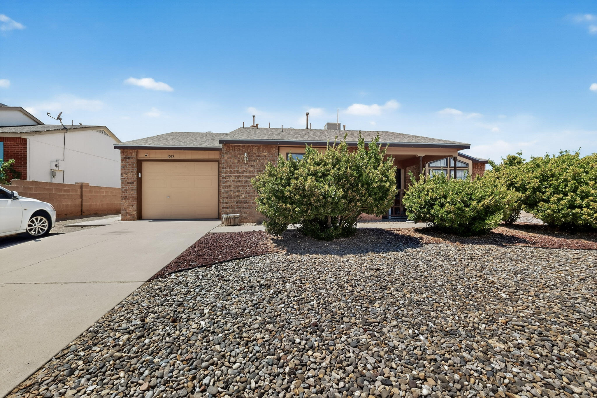 Don't miss this beautifully maintained 3-bed, 2-bath gem in sought-after Rivers Edge! With 1,424 sq ft of well-designed space, this home features a spacious kitchen with breakfast bar--perfect for gatherings--and a large primary suite with TWO walk-in closets. Enjoy the private, low-maintenance backyard with a full brick wall and side access--ideal for outdoor living. New evaporative cooler (2024) adds comfort and value. All this in a prime location close to shopping, dining, and more. A must-see!