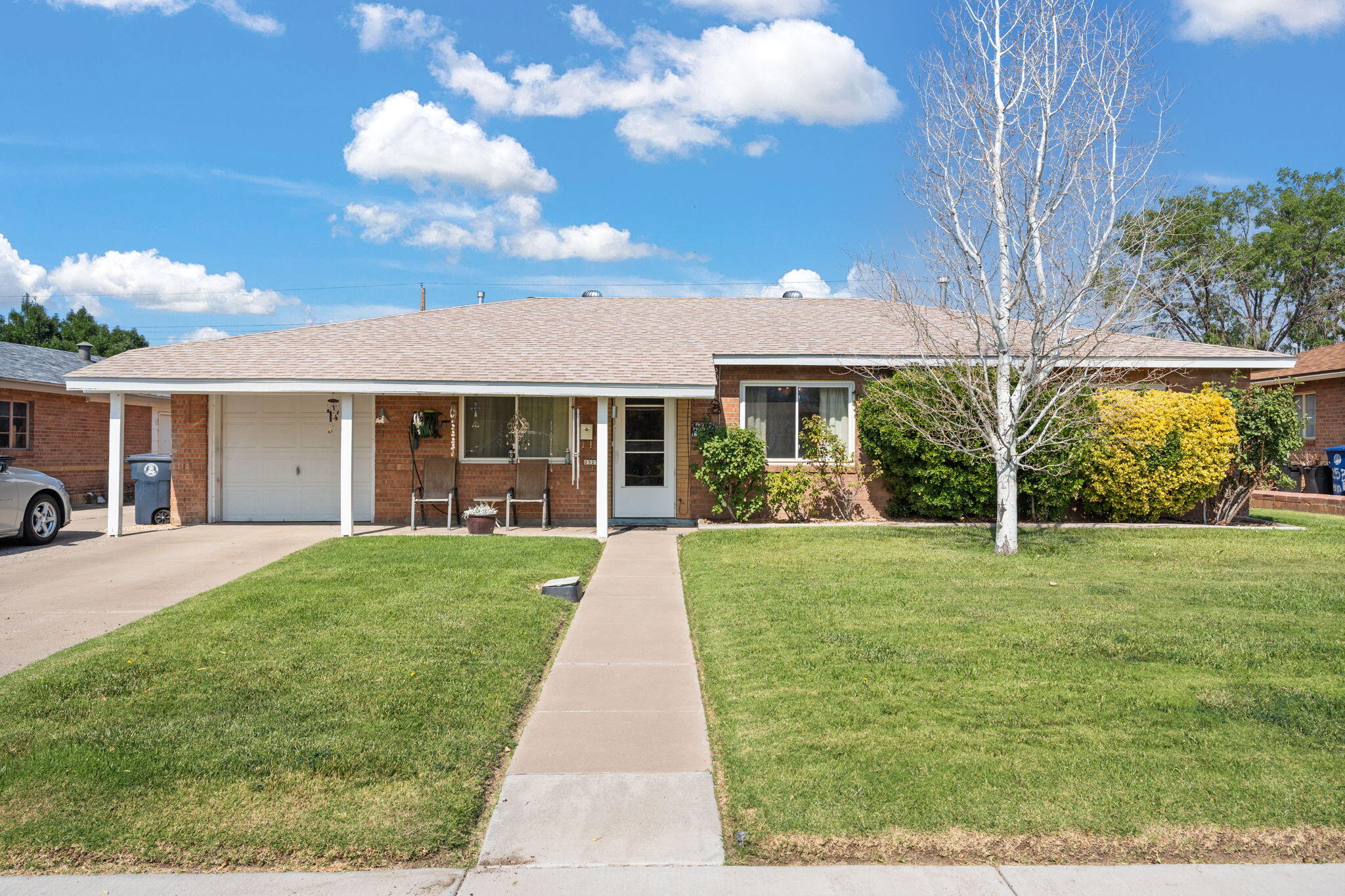 Welcome to this charming NE Heights all brick home, not far from ABQ Uptown and all the great shopping and restaurants. Updated windows, roof, heating and evaporative cooling.  Updated kitchen features granite counters and lots of cabinets plus a new gas range as of July 2025. Gorgeous landscaping front and back with lawn, trees and flowers. Home needs paint and new flooring but priced for a new owner to be able to do that and make it their own. Manual sprinkler system in front, drip in back except rose bushes. As-is seller will make no repairs.
