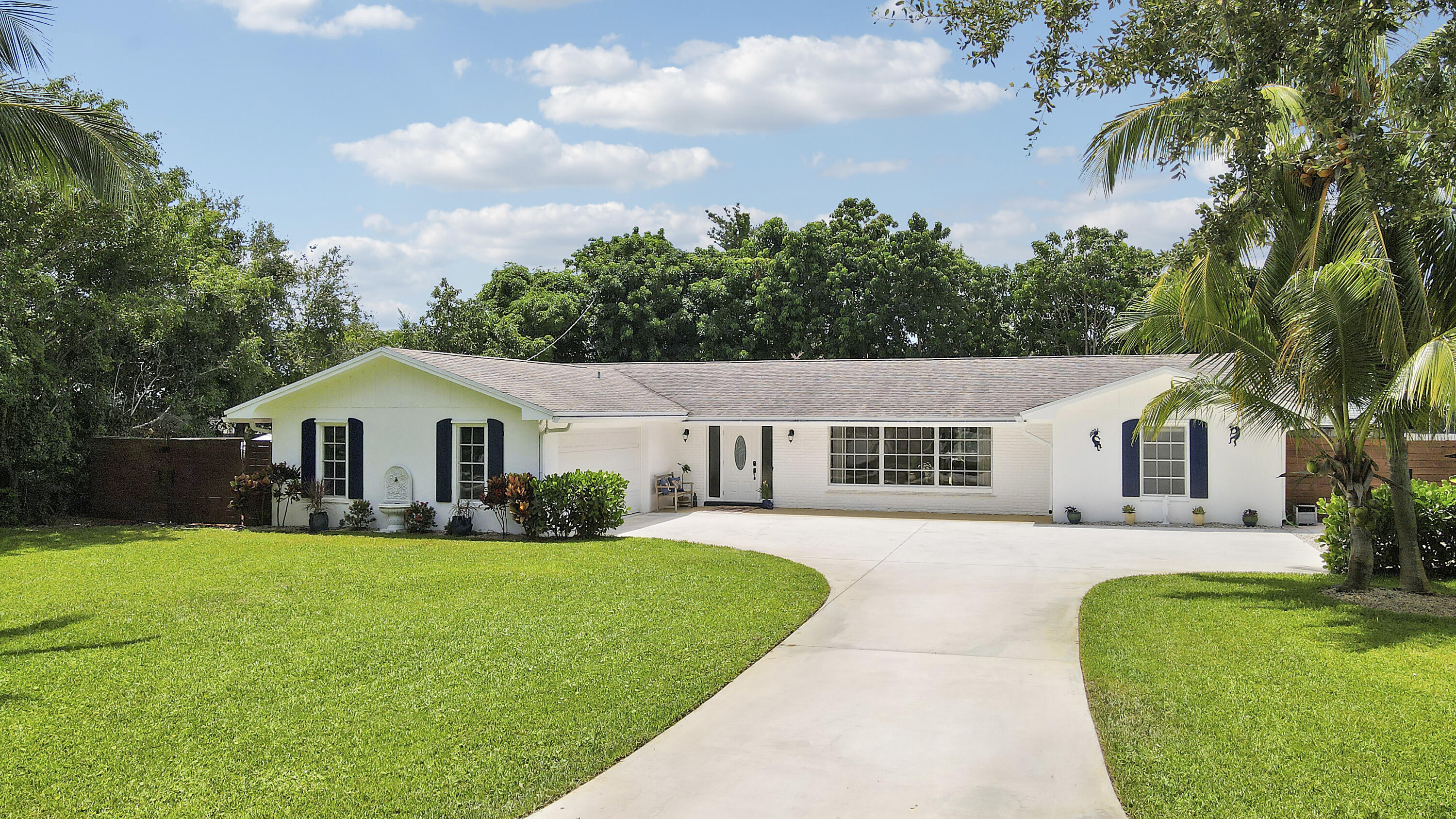 Welcome to 339 Country Club Drive, where South Florida living meets comfort and style.This spacious CBS home features 4 bedrooms, 2 baths, and a 2 car garage, ideal for those seeking a versatile living space. Situated on a generous lot, the property includes a large side yard perfect for parking your boat and offers complete hurricane protection.Inside, the home is bright and inviting, with new flooring, a kitchen that is equipped with newer appliances, quartz countertops and features a large pantry, perfect for all your storage needs. The large kitchen window and two sliders provide stunning views of the outdoor space including a resurfaced pool and private, fully fenced backyard.The home offers a split floor plan with an interior laundry room and the primary suite offers a dual vanity with granite top and a large walk-in closet, providing a private retreat within the home.

Outdoor lovers will appreciate the expansive patio with a large covered space equipped with ceiling fans, perfect for al fresco dining. The entire patio area is enclosed with a screen, making it ideal for enjoying the outdoors year-round.

Additional features include highly sought after designated boat parking on the east side of the home, with easy access just blocks away from the neighborhood boat ramp and dry dock available for a small yearly fee. The property also offers two storage sheds and ample grassy areas, perfect for kids, pets, gardening, or your favorite outdoor activities. The beautifully manicured lawn adds to the home's curb appeal.

Located just minutes by bike, golf cart, or car from Tequesta Country Club and Golf Course, Turtle Creek Golf Course, the Loxahatchee River, Gallery Square North and South, and Constitution Park, this home offers convenience and a laid-back lifestyle in the highly desired Tequesta area. 

Tequesta Country Club offers optional membership and provides boat ramp access for a nominal fee. Enjoy community amenities like a picnic area, communal tennis courts, and a putting green. Don't miss this opportunity to embrace the South Florida lifestyle!