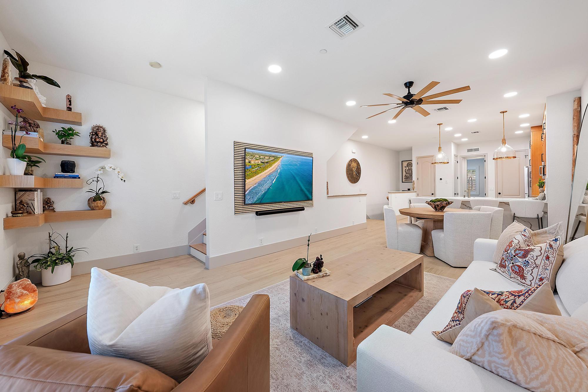 Step into a townhome like no other--where clean, contemporary elegance meets warm, inviting design. Located in the highly desirable gated community of Cielo, this meticulously upgraded 3-bedroom, 3.5-bathroom CBS-built residence spans 2,274 square feet and has been reimagined from top to bottom with the finest finishes and attention to every detail.From the moment you walk in, you'll notice the elevated design--tile flooring flows throughout, wide-plank white oak flooring on stairs, fresh paint in crisp tones brightens every room, and vaulted ceilings expand the space. The heart of the home is the custom-designed kitchen, featuring waterfall-edge quartz countertops, floor-to-ceiling soft-close white oak cabinetry, and brand new high-end Bosch appliances. It's an entertainer's dream with a seamless open-concept layout connecting kitchen, living, and dining. New water heater and new AC with UV light and automatic self-cleaning system for AC drain, modern baseboards, and a state-of-the-art alarm system are included. The entire house features impact windows, along with a new impact-resistant front door and sliding glass door. The home is electric car-ready with a charging hook-up in the oversized, 2-car tandem garage, providing additional generous storage space and a bonus refrigerator/freezer.

Smart home features abound&#x14; from the thermostat, doorbell/camera to the lights, integrated carbon monoxide detectors, and more.

Each bedroom offers its own bathroom, plus a half bath with two of the bedrooms privately located upstairs on the top floor. The primary suite is a retreat of its own&#x14;light-filled and luxurious, with two fully built-out walk-in closets and a spa-style bathroom complete with a freestanding soaking tub, floating shelves, walk-in shower, separate water closet with a Toto washlet bidet toilet, dual vanities, and LED mirrors with defogger. The secondary guest room, generous in size has its own freshly remodeled en-suite bathroom and a custom built-in walk-in closet. An additional full bedroom and bathroom is offered on the main living level providing flexibility for guests or family.

Downstairs, a bonus den/office/workout space offers its own private entrance, half bath, and direct garage access. Multiple living zones and thoughtful design make this home feel more like a single-family residence than a typical townhome.

Furniture negotiable - partially or fully (excluding certain items per seller choice). Top of the line luxury brands - Restoration Hardware, West Elm, Arhaus, Pottery Barn, and more.

Located in the gated enclave of Cielo, enjoy a private setting just steps from Donald Ross Village with premier dining, shopping, fitness studios, and more. Just minutes to I-95, Gardens Mall, and Jupiter's stunning beaches, this location combines convenience with lifestyle.