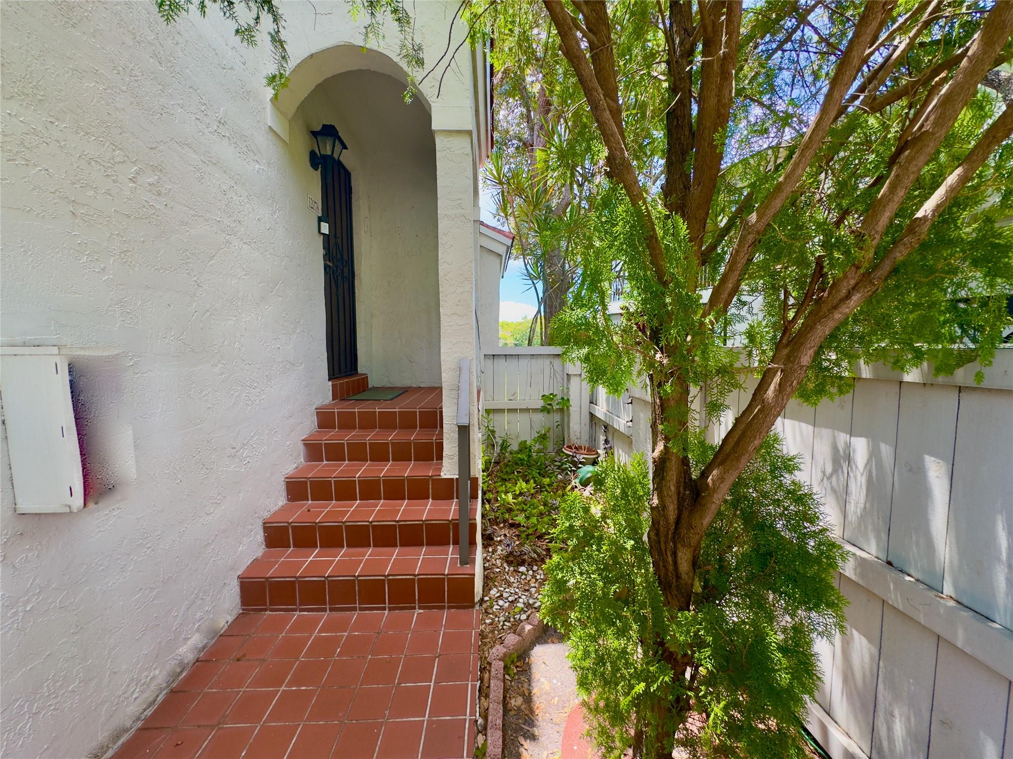 Check out this 3-bedroom, 2-bath corner unit overlooking the lake in the gated Pierpointe community with 24/7 security. You will love the split floor plan, beautiful wood floors, and plantation shutters throughout. The open kitchen features granite countertops and stainless steel appliances, perfect for cooking and hanging out. Step outside to a big patio with peaceful lake views — great for relaxing or entertaining. Extras include a tankless water heater, accordion shutters, and washer/dryer inside. The roof was replaced in 2024, and the community is getting a fresh new look with paint, PVC fences, and updated signage. Plus, it’s super convenient — close to hospitals, shopping, A-rated schools, and easy highway access. Updated corner unit in Pierpointe with lake views, granite kitchen, wood floors, shutters, tankless water heater, and 24/7 gated security. Community updates coming.