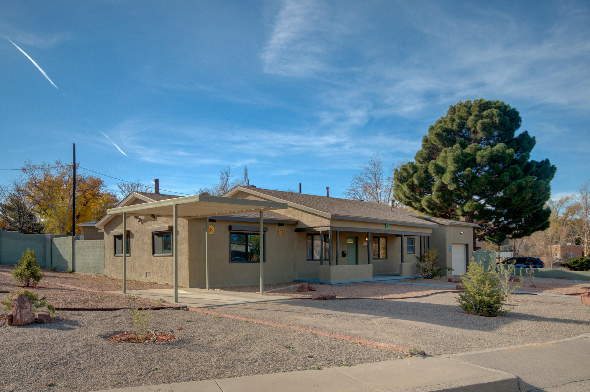 Discover this charming upgraded home in a prime location, just moments away from UNM Hospital. This property features a desirable in-law quarters/casita, perfect for extended family, guests, or rental opportunities. This home is situated on a large corner lot with backyard access, pitched roof(s), landscape drip system, refrigerated air conditioning, upgraded kitchen with stainless steel appliances.