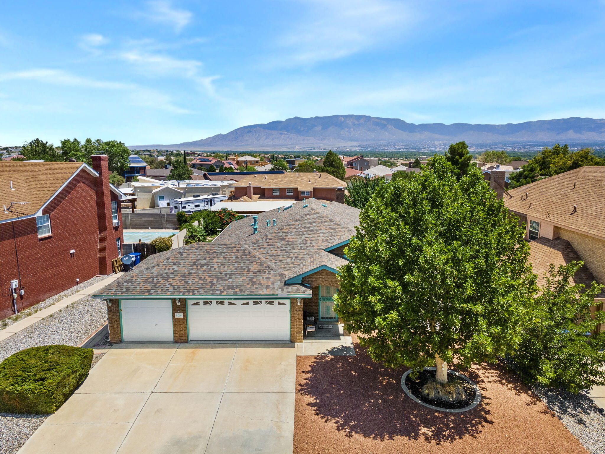 Welcome to this charming Opel Jenkins-built brick home in the desirable Taylor Ranch neighborhood. Offering a thoughtful single-level ranch style layout, this 3-bedroom, 2-bathroom residence combines comfort, function, and timeless style.Step inside to a light-filled living room with raised ceilings and dining area, creating an airy and inviting atmosphere. The spacious kitchen with additional dining area flows seamlessly into the family room, making it perfect for both everyday living and entertaining.The primary suite features a walk-in closet, a double-sink vanity, and plenty of space to unwind. Two additional bedrooms and a full hall bath provide comfort and privacy for family or guests.Enjoy New Mexico's beautiful weather in the landscaped front and back yards,