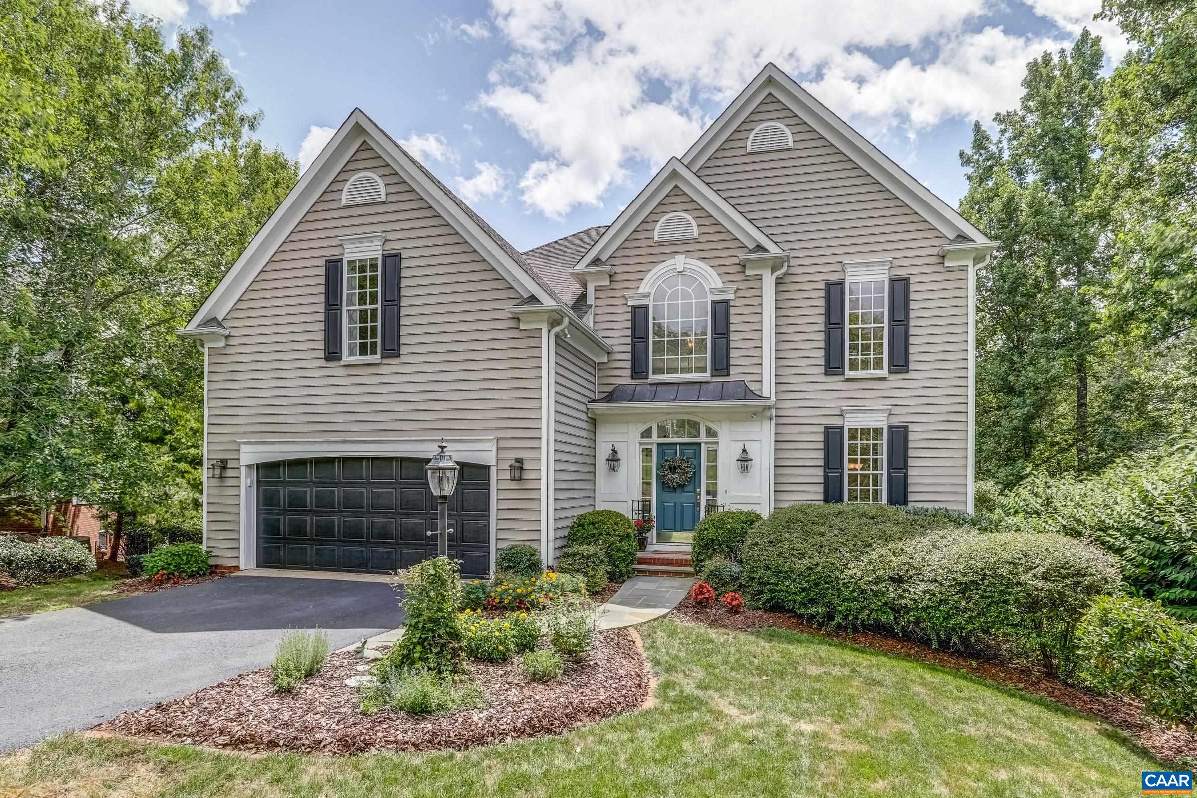 Nestled in one of Cville's most sought-after neighborhoods, this great 5-bedroom, 3.5-bathroom home has been lovingly maintained. With thoughtful landscaping and a canopy of mature trees offering natural shade and privacy, you’ll feel worlds away from town yet you’re only 5 minutes from shopping and restaurants and 10 minutes from downtown. High ceilings, tons of windows, and tasteful finishes set the tone for the rest of the home. The main level primary suite is a sun-drenched oasis and features generous walk-in closet and a primary bath with soaking tub, separate shower, and large vanity. The heart of the home is the updated kitchen with quartz counters, ceramic tile backsplash, newer stainless steel appliances, a sunny breakfast area, and convenient connection to the dining room. The great room boasts an impressive cathedral ceiling with two-story wall of windows and easy access to the lovely deck space. Upstairs, you'll find four generously sized bedrooms with ample closet space, perfect for family members, guests, or a home office setup. Two full bathrooms upstairs complete the 2nd level. Enjoy the screened porch escape and don't miss the huge unfinished basement offering endless storage or future rec room and so much more!