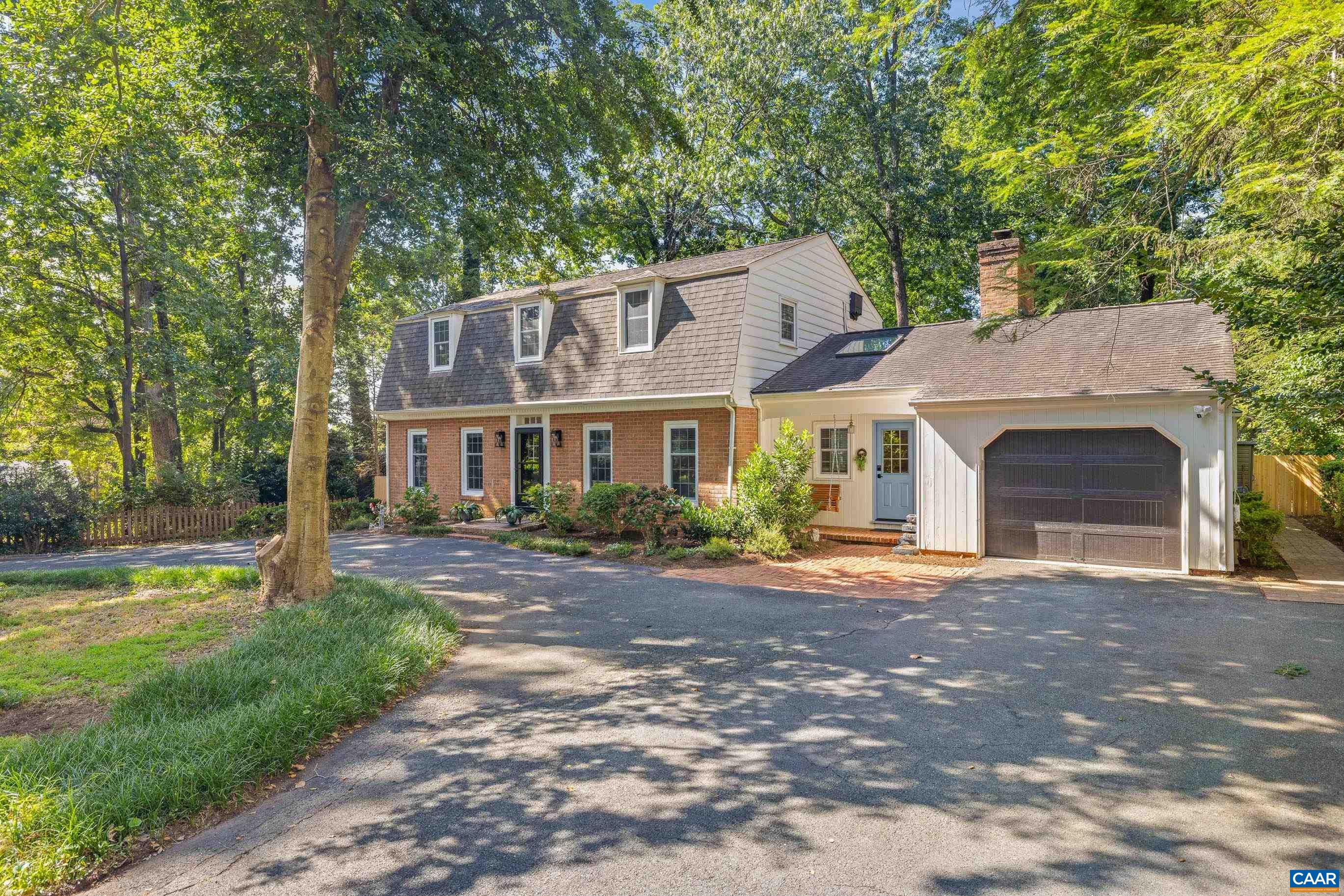 Rarely does a home offer this much character, space, and convenience on nearly half an acre in a quiet, established neighborhood. Recent updates include a brand-new roof (25-year gold warranty), all new energy-efficient windows and exterior doors, and more. Bathed in natural light and full of charm, this 4BR/3BA home blends thoughtful upgrades with timeless details. A main-level primary suite anchors bright, interconnected living spaces where the granite island kitchen with gas cooktop opens to the sunroom/dining with brick floor, keeping room, and family room, with the living room visually linked for easy conversation. Original hardwood floors, built-ins, a spacious home office, three fireplaces, and a finished walk-out basement bonus room add comfort and versatility. Outside, dappled light filters through mature trees onto a private, fenced backyard with brick patio, perfect for quiet mornings or lively gatherings. Minutes to Whole Foods, UVA, Stonefield, Barracks Rd, Ivy Creek Natural Area, wineries, breweries, markets, and trails. OPEN HOUSE SATURDAY Sep 6, 12PM - 2PM!