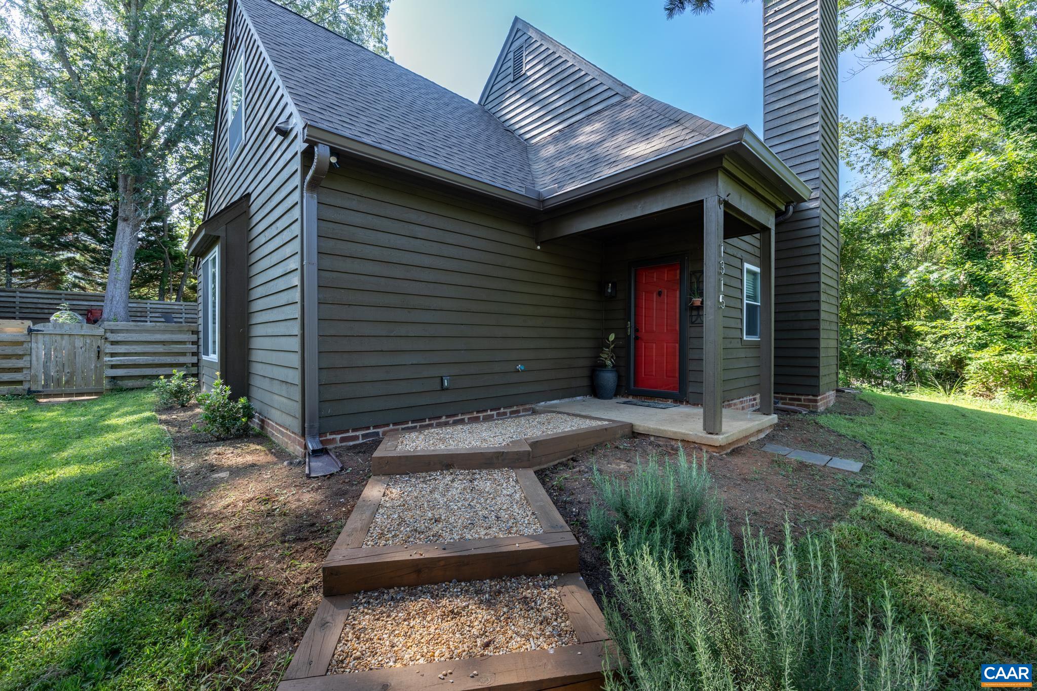 Charming 4-bedroom, 2-bath home in a PRIME Charlottesville location. Though the official square footage is 1,566 sqft, the flowing layout and generous room sizes feel like a spacious 2,500 sqft, giving you room to breathe and entertain. Inside, you’ll find a welcoming open-concept living area anchored by a cozy wood-burning fireplace and easy flow from the living room to the dining area and kitchen. Bright, modern kitchen featuring rich granite countertops that anchor the space with a durable, timeless surface and stainless steel appliances for a sleek contemporary touch . A first-floor primary suite adds everyday ease and flexibility. Step outside to a fully fenced yard, perfect for outdoor living, playtime, and entertaining. The home sits on a peaceful street within a tight-knit neighborhood, providing a quiet retreat while keeping you minutes from everything Charlottesville has to offer. walkable access to Biscuit Run Park and its trails, and close proximity to Wegmans, 5th Street Station, and Downtown Charlottesville. A truly unbeatable setting for comfortable living with unmatched convenience. Full renovation, including a new roof, completed in 2023.
