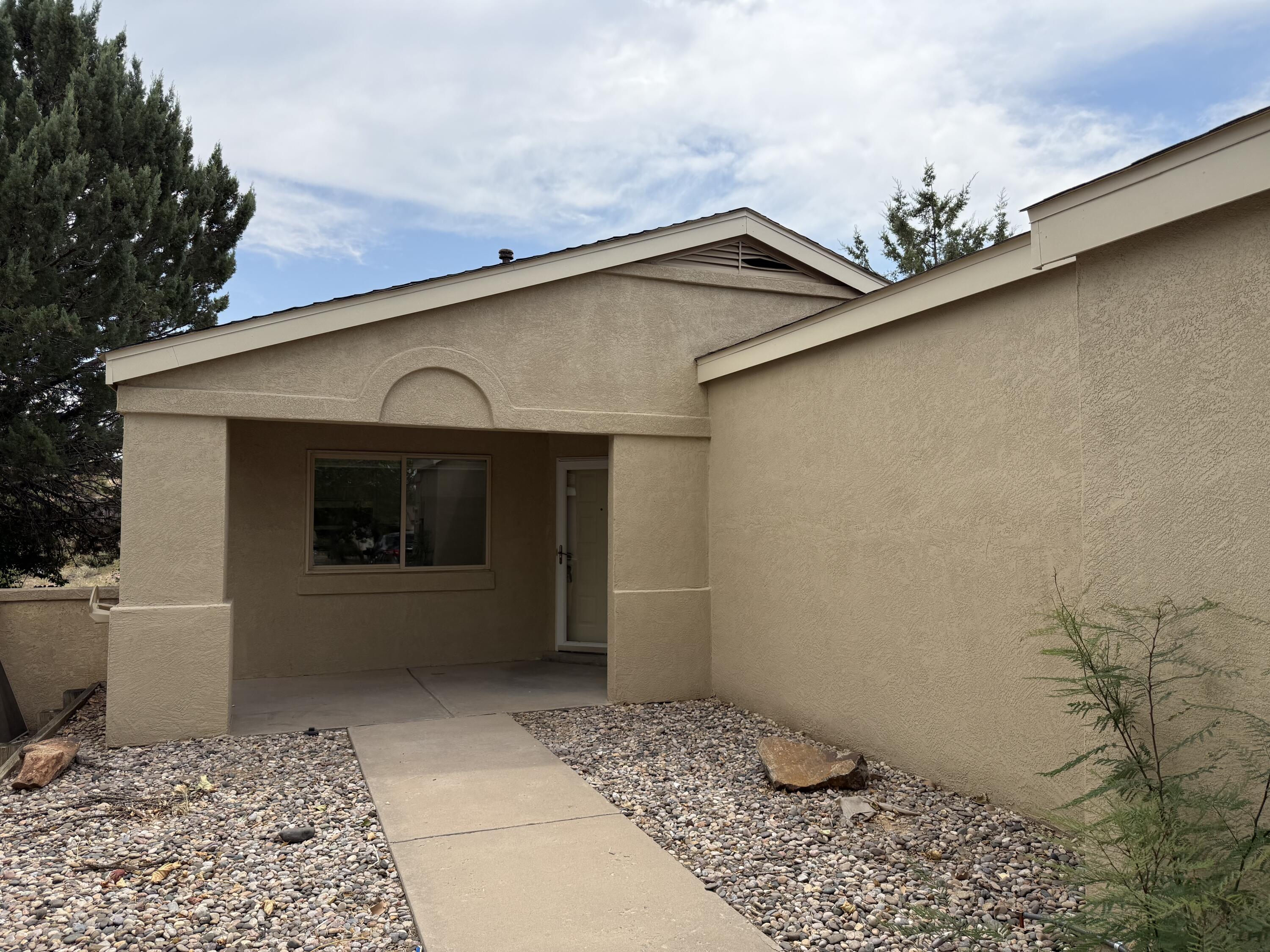 single-story house with a one-car garage. This home boasts all-new two-tone paint, new LVP and carpet, new solid surface countertops, new stainless steel appliances, and more. The back bedroom has its own mini split system for heating and cooling.