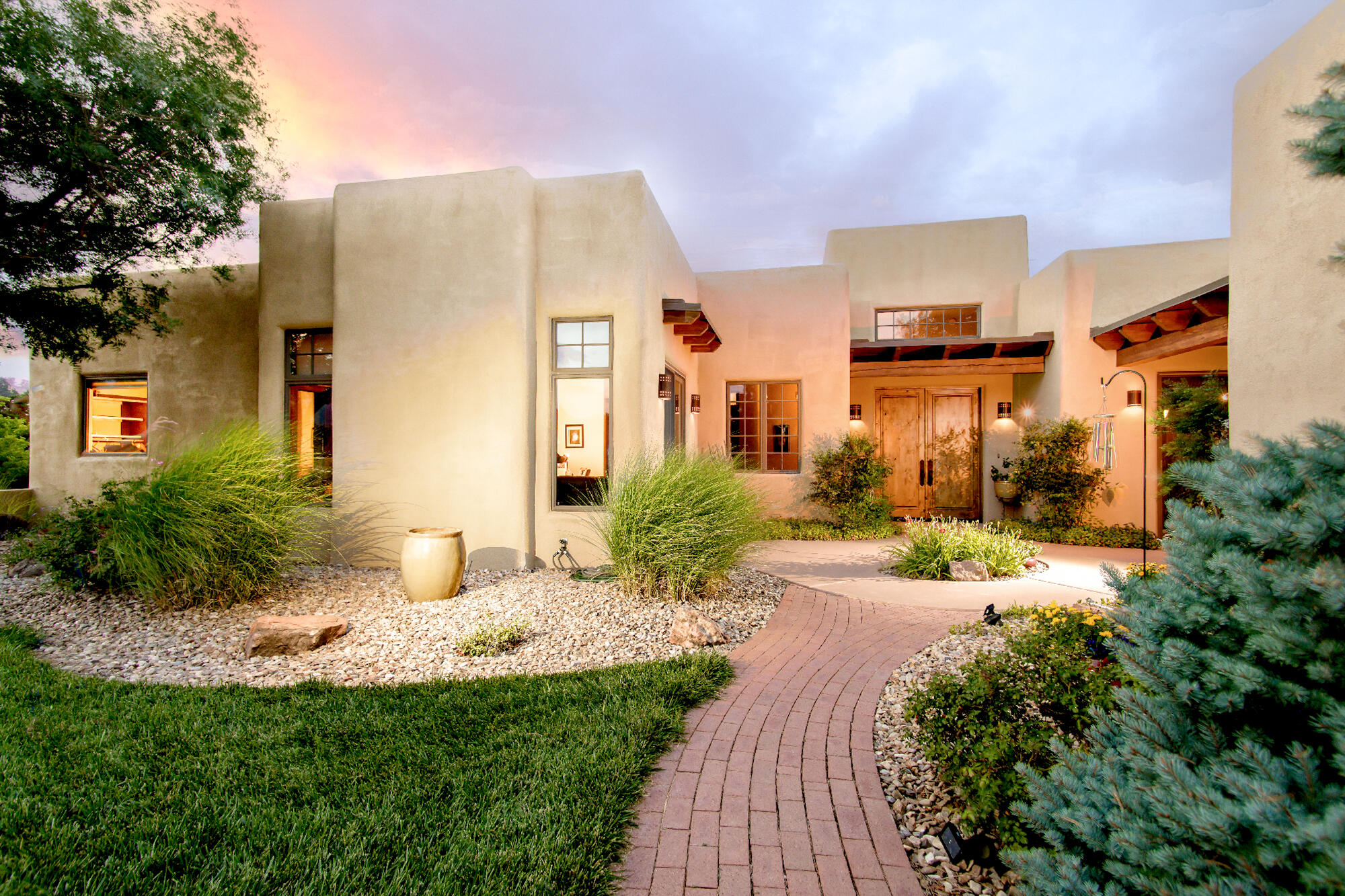 Truly stunning custom home on 10 private acres in San Pedro Creek Estates. Enjoy 360-degree mountain views from this soft Southwest contemporary with warm, understated elegance. Quality finishes include Turkish travertine, granite, custom alder wood doors, and Craig Sowers cabinetry. Features include 3 fireplaces, a gourmet kitchen with butler's pantry, large walk-in pantry, and spacious great room. Separate owner's wing offers privacy, an office, and access to a serene courtyard. Oversized 3-car garage includes a large workshop/storage area. Beautifully landscaped with outdoor living spaces designed for relaxation and entertaining.