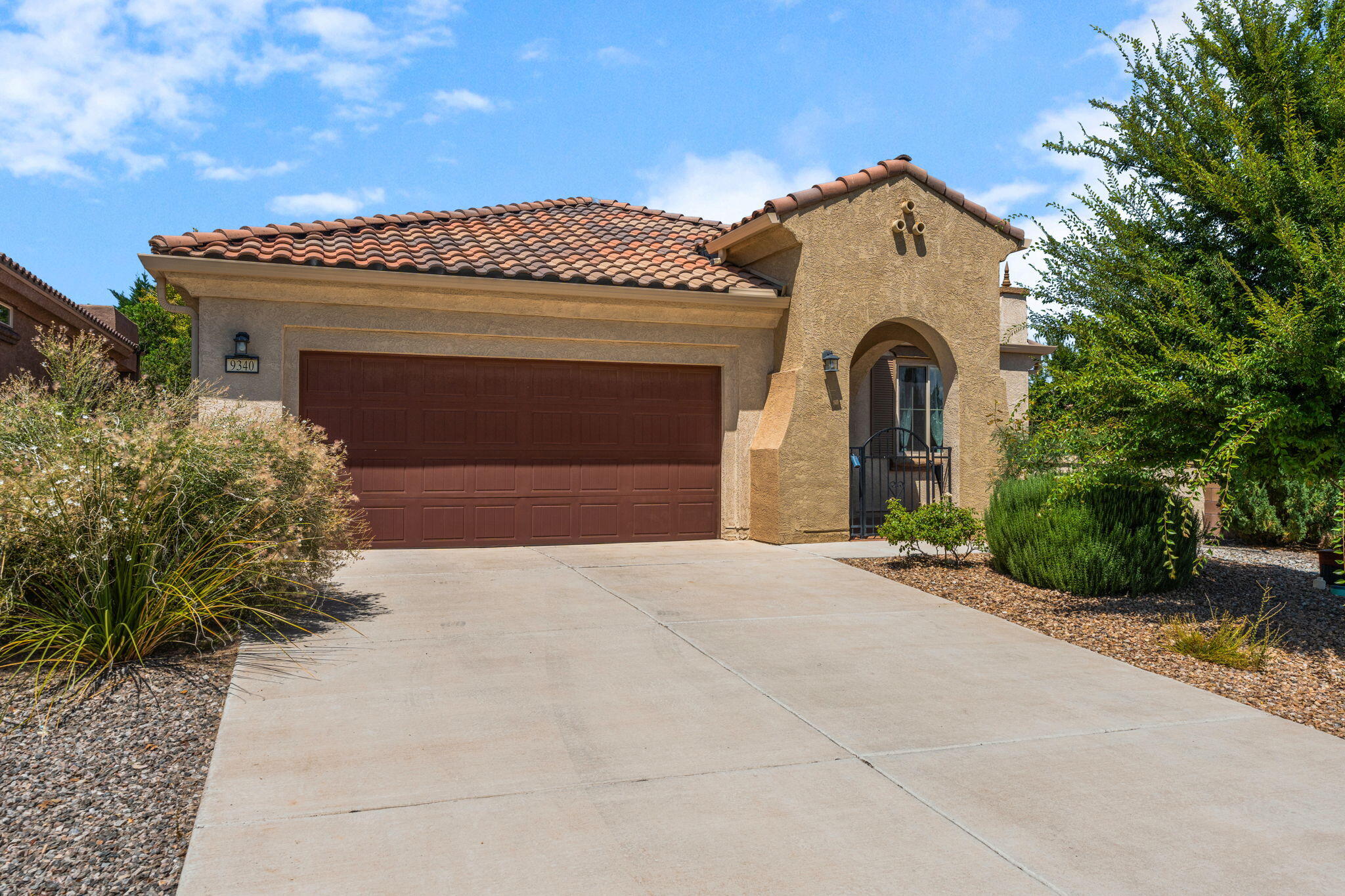 A TRUE SANCTUARY INSIDE & OUT! Welcome to a rare opportunity in this coveted 55+ community, where comfort, elegance, and serenity meet. This home features the desirable Sanctuary Floorplan, and that's not just in name. The backyard truly lives up to it. Situated on a premium corner lot, you'll enjoy views and exceptional privacy. Step thru oversized sliding glass doors & you're greeted by a covered patio, mature trees, blooming plants, creating a cool, tranquil retreat, a stark contrast to the typical SW landscaping. Inside is the stunning kitchen, boasting granite countertops, a STUNNING granite island w/ farmhouse sink, SS appl to complete the gourmet touch. Open concept living & dining, beautiful light fixtures, extra large PB upgrade. If you're seeking a true sanctuary, YOU'RE HOME!