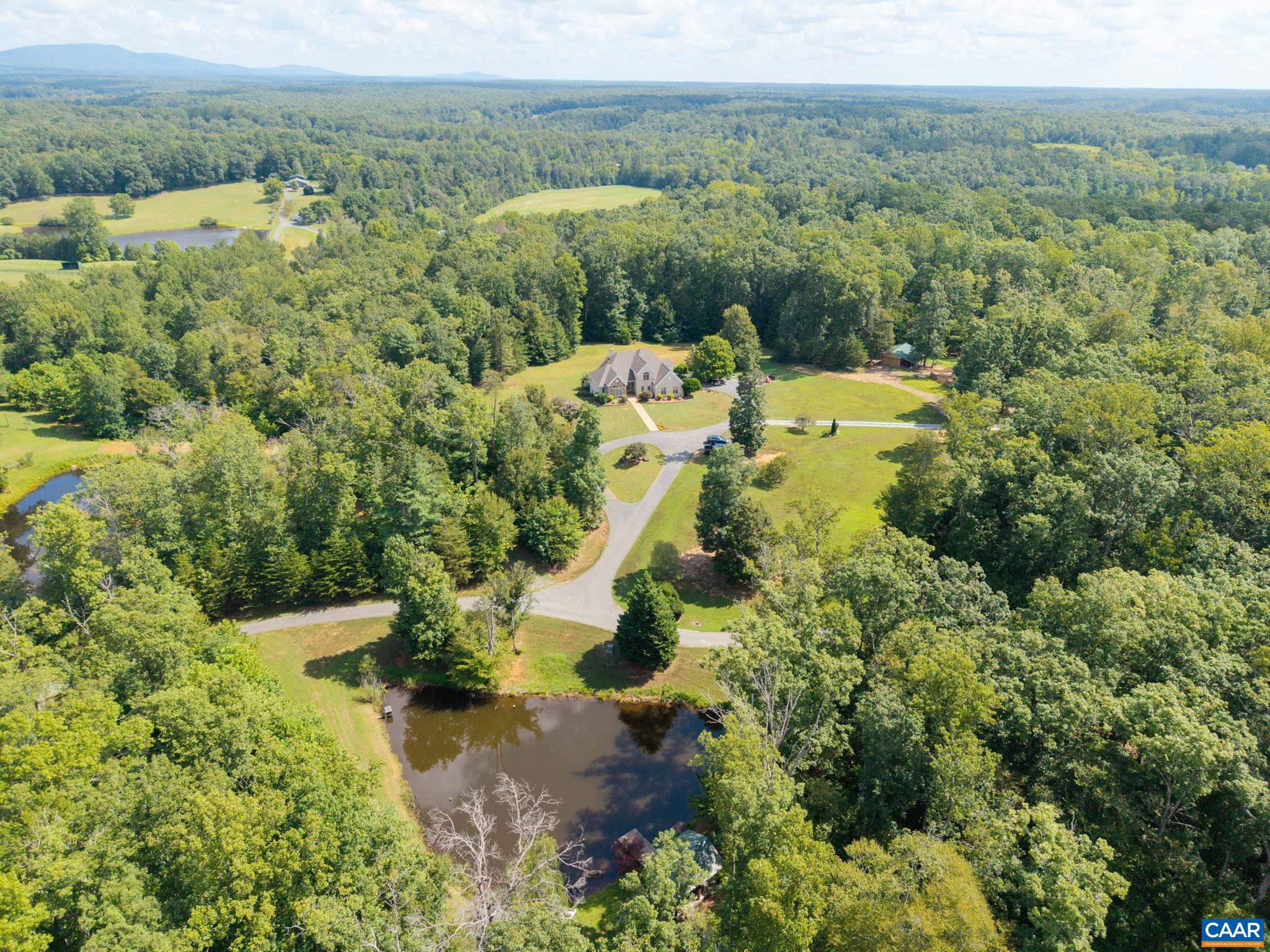 A hidden gem within the scenic Keswick area!  Only 10 minutes to Charlottesville and a couple minutes to I64 makes this location ideal!  With over 33 acres, multiple ponds, a main house and a 2000 square foot cabin, the possibilities of this property are endless! There is even a portion of the land that has been used for weddings in the past! Bring your ATV!  This property is the Outdoorsman's dream as it offers plenty of room for hunting and fishing!  Turn it into your own personal retreat! Plenty of room for extended family or guest! The main house is custom built and holds a bit of history as the woodwork is from James Madison's Montpelier.  You will find high craftsmanship through-out, including the Italian tile on the back porch. Make your appointment and come claim it for yourself!