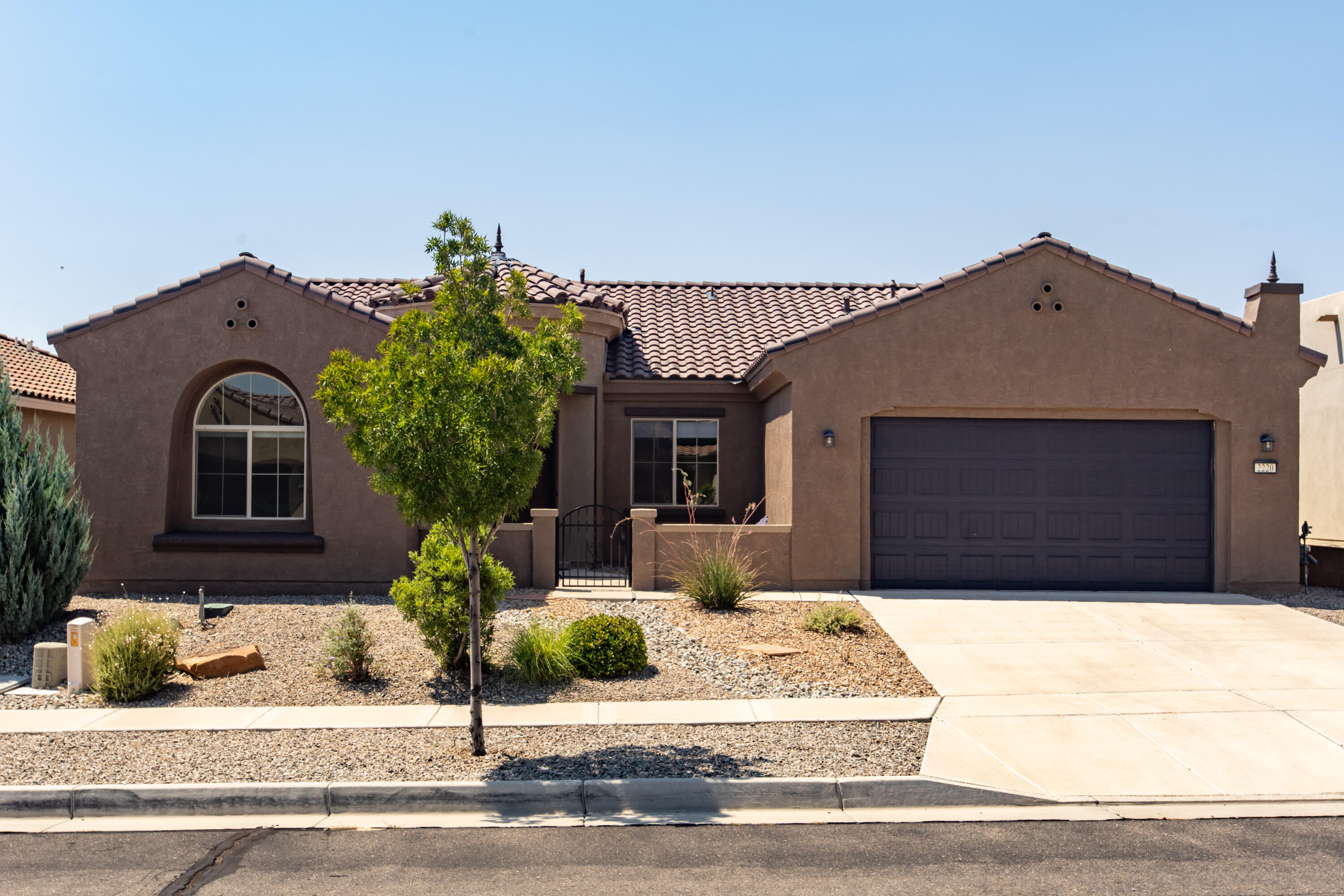 Welcome to your dream home nestled in the heart of a serene, gated 55+ active adult community! This stunning house boasts 3 BR's 2BA's, 2CG, Office, OWNED SOLAR PANELS, Gorgeous Chefs Kitchen, Granite Countertops & Beautiful Splash, All Appliances Stay including Washer & Dryer!  Wood Look Tile, Wood Flooring in   Primary BR & 2nd BR. Nice covered patio &  private backyard. This home is an enchanting blend of comfort and style, making it the perfect sanctuary for those seeking a life of relaxation and adventure. Surrounded by the natural beauty of the Petroglyphs, you'll find the best of both worlds--tranquil living paired with easy access to breathtaking outdoor activities. Enjoy the Sandia Amenity Center w/daily activities, pickle ball, tennis, outdoor pool, Full Gym, and so much more!