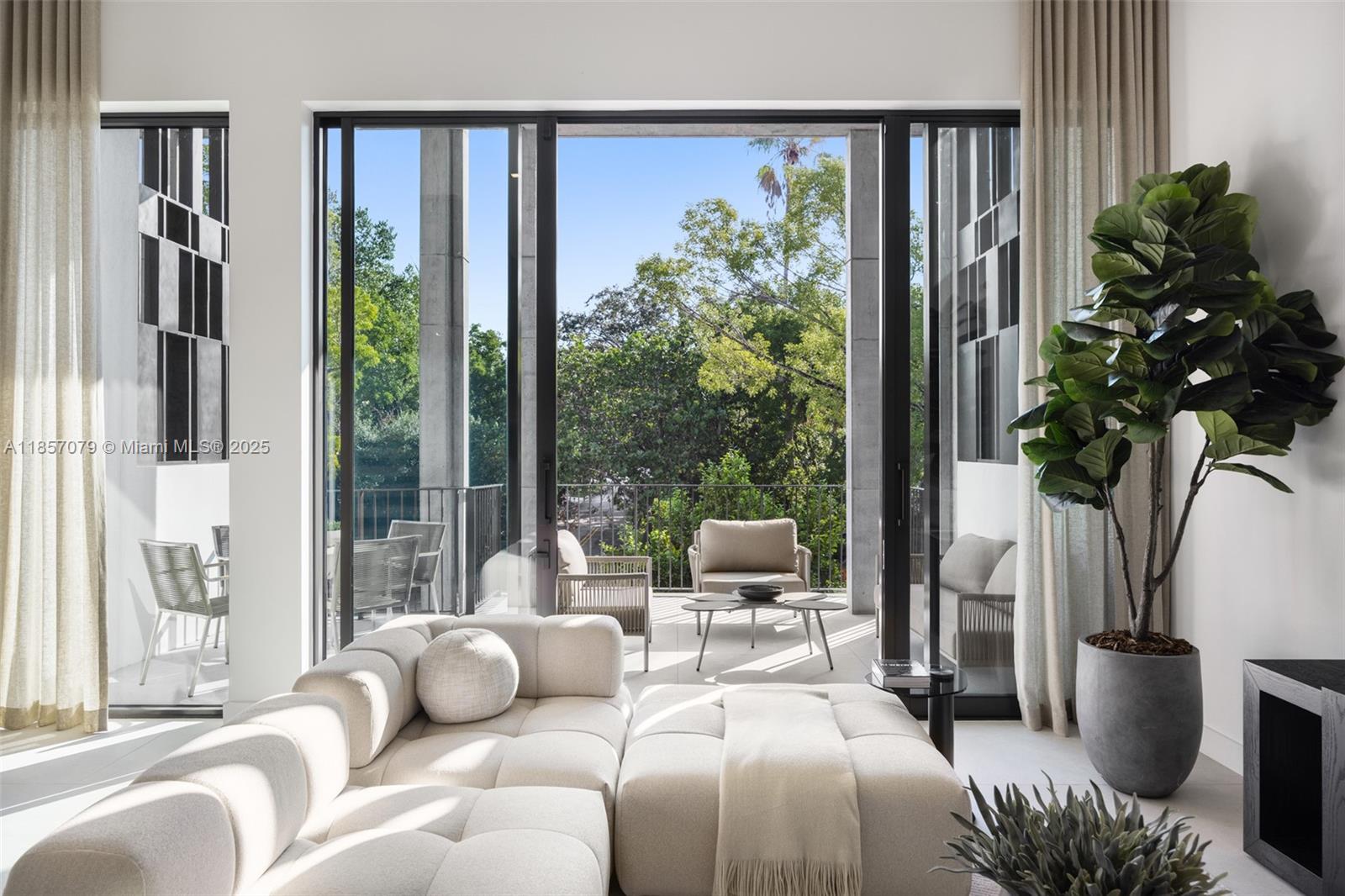 Award-winning contemporary residence in The Roads Townhomes featuring a distinctive formed-concrete façade. A dramatic open stairwell, volume ceilings and skylight define the airy interior. The sprawling second-floor living space with 12’ ceiling flows to a giant, glass-walled terrace. The chef’s kitchen offers Italian cabinetry, Wolf-Sub Zero appliances, porcelain slab surfaces and 10’-wide island for prep and counter dining. Spa-style master bath includes a freestanding tub, dual vanities and glass-walled shower. Additional highlights: multiple balconies, sound-insulated, private entry courtyard, Mondrian-inspired privacy screens, full-size 2-car garage and concrete construction with impact glass.