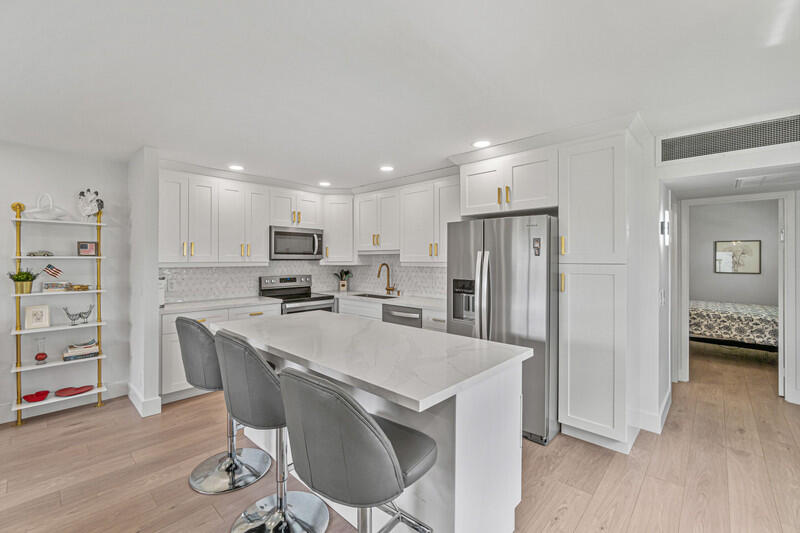 Turnkey  and completely renovated 1/1.5 plus enclosed Florida room in Valencia section of Kings Point. This corner apartment shows like a model with a gorgeous white kitchen with large island, quartz countertops, and stainless steel appliances. Luxury vinyl flooring throughout, two renovated bathrooms, smooth ceilings, and lots of windows with natural light.  Kings Point is a premier 55+ community with 24/7 gate access and a state of the art clubhouse facility with multiple pools, tennis, clubhouse, fitness center, restaurant, card rooms, and the list goes on.