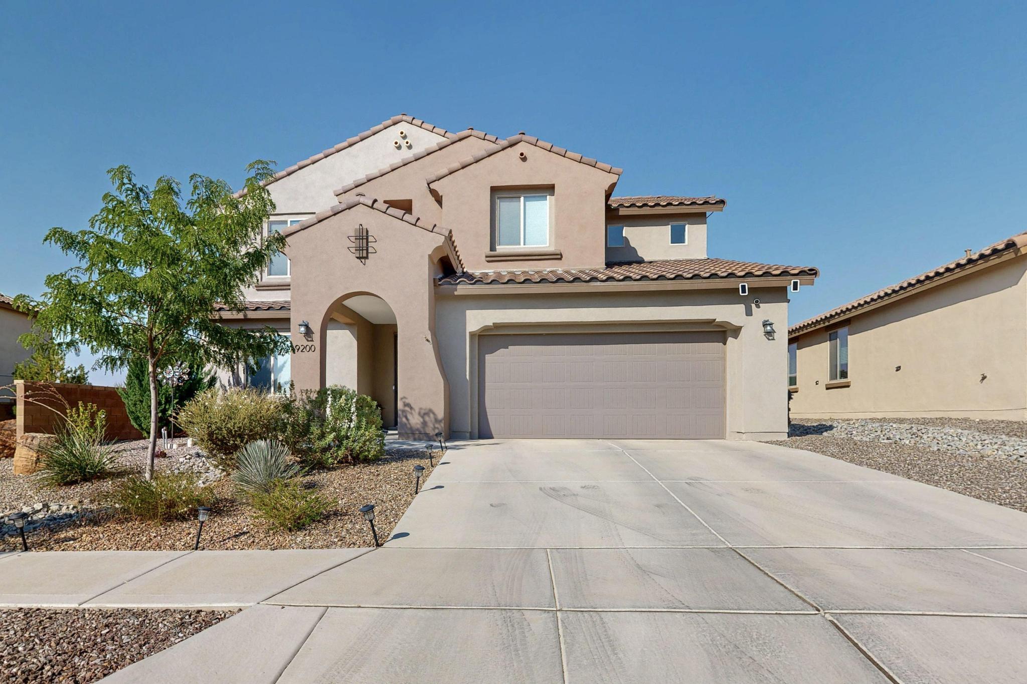 Beautifully designed Pulte home with a bright, open floor plan, owned solar panels, and Build Green NM Silver Certification for energy efficiency and lower utility costs. The main level offers a spacious office or study that can serve as a 5th bedroom, a light-filled living room with soaring ceilings, and a stylish kitchen featuring an eat-in bar, stainless steel appliances, abundant counter & cabinet space, an oversized pantry, and a dining area with views of the backyard.Upstairs, you'll find four bedrooms, including the primary suite with a walk-in closet, garden tub, and separate shower, plus a versatile loft and a convenient laundry room.Outdoor living is easy with a covered patio and a beautifully landscaped backyard. A three-car tandem garage offers plenty of storage or..