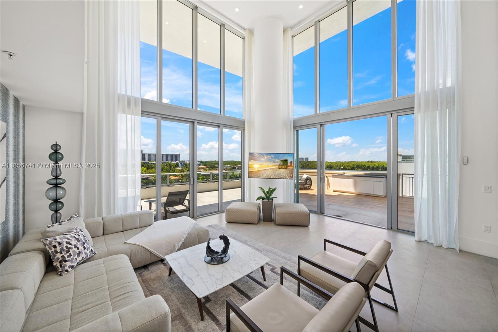 One-of-a-kind, two-level corner residence where light-filled interiors meet sleek modern design and floor-to-ceiling windows frame incredible water views from every room. Residence offers 4 bedrooms, 4.5 baths and a den that has been transformed into a private office. Two luxurious primary suites provide flexibility and privacy, one conveniently located on the first level and the other on the upper level. Gorgeous open Italian kitchen with quartz countertops flows seamlessly into the grand living room creating the perfect space for entertaining. Enjoy your days barbecuing and sunbathing on expansive wraparound terrace with your own private pool, outdoor shower, and endless water views. Residents also enjoy access to resort-like amenities. 2 assigned parking spaces and 2 valet parking.