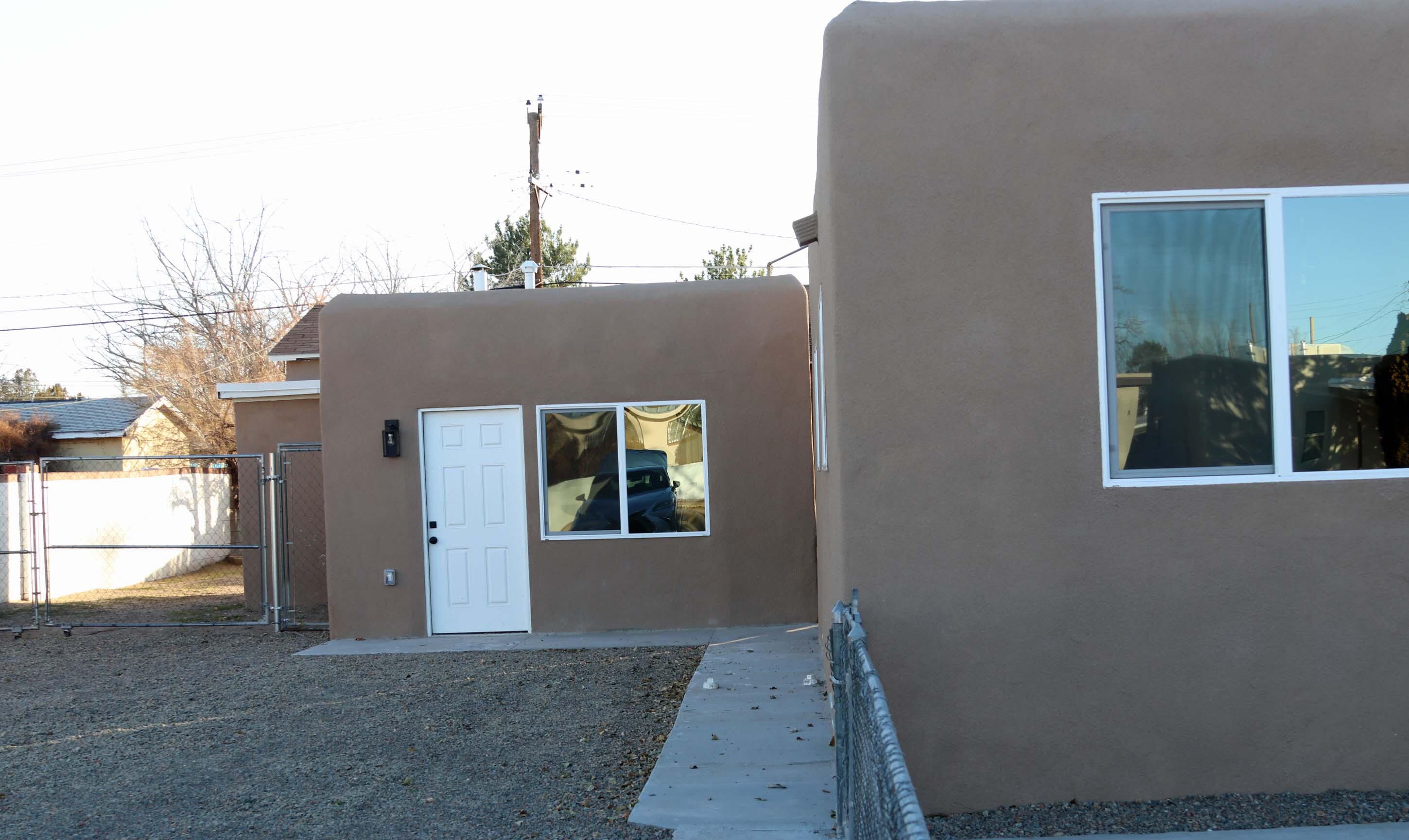 OWNER FINANCING! Beautiful update HOME PLUS A CASITA!  New LVT wood-look flooring, new carpet, designer lite fixtures, attractive tile & new windows. Classy kitchen w/ quartz counter tops, plenty of cupboard space, sparkling new stainless appliances & stylish farm sink. Main house consists of 3 bedrooms, 1 full bath, living room & kitchen - 911 SF. The casita offers 1 bedrooms, 1 bath, living room & a kitchen - 785 SF. House + casita = 1696 SF. Each unit offers it's own electrical meter. Long 4 or more car driveway, & BACKYARD ACCESS for more toys! So what do YOU need? Room for extended family or in-laws quarters? Would you rent out one unit to supplement your mortgage? Are you an investor looking for cash flow & want to rent both units? REC w/ 20% down, 10% interest, 5 yr call. WOW!