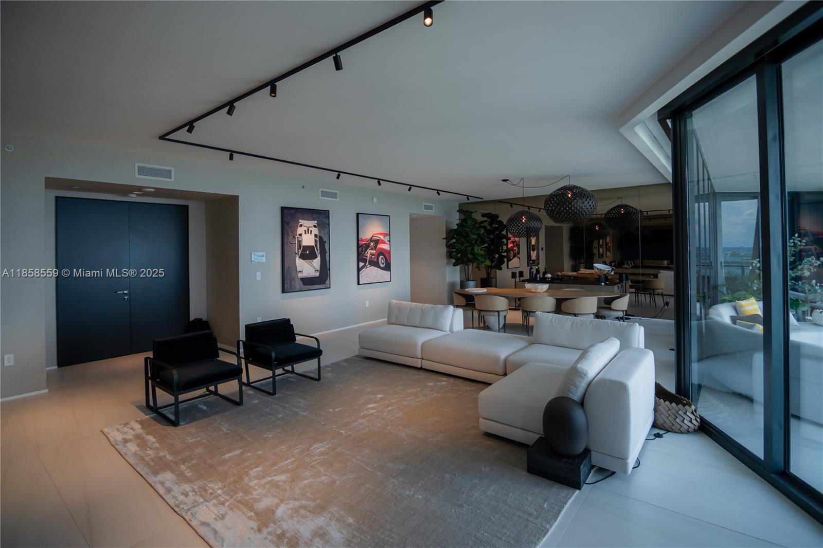 Unit 3502 at One Thousand Museum by Zaha Hadid offers a rare half-floor layout wrapped in floor-to-ceiling glass with unobstructed views of Biscayne Bay, the Atlantic Ocean, and the Miami skyline. This fully furnished Artefacto-designed home features Poliform cabinetry, quartz countertops, Sub-Zero & Gaggenau appliances, a custom wine display, motorized shades, and distinctive built-in furniture throughout. The primary suite includes an added walk-in closet and private terrace with sunset views. Enjoy world-class amenities including the Sky Lounge, Aquatic Center, Wellness Center, rooftop helipad, and 24/7 concierge, valet, and security — all just minutes from Miami’s waterfront, fine dining, and luxury shopping.  Artefacto furniture included.