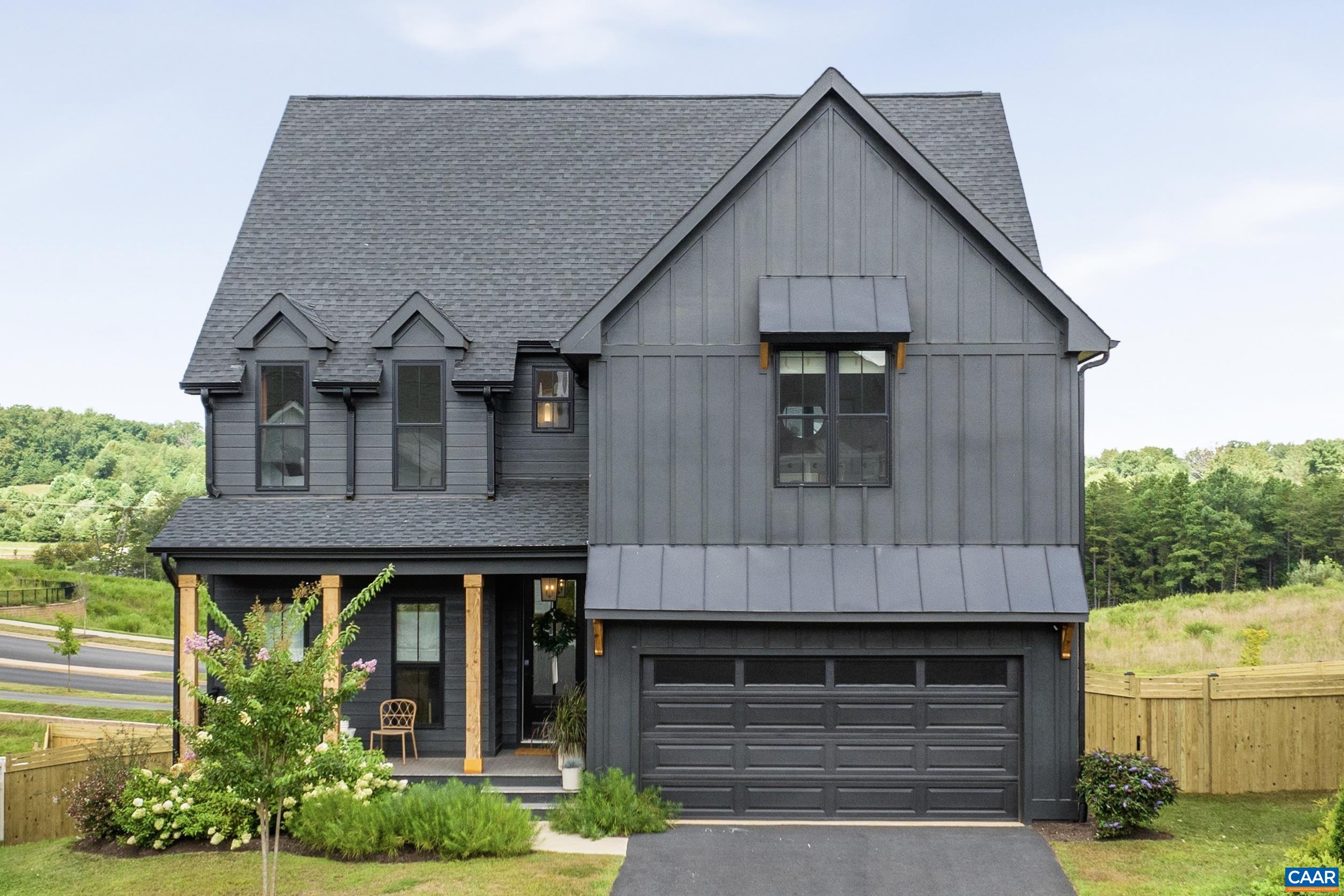 Better than new, this immaculate home sits on an oversized lot and boasts custom premium finishes, designer details, and every upgrade already complete (see full list in documents). Owner curated finishes, from bespoke tile to elegant lighting and mirrors, make this home truly custom. The open, light-filled layout offers a highly functional floor plan with no wasted space. Featuring five bedrooms, four full baths, and two half baths, plus a dedicated home office and gym, every space is enhanced with unique, exquisite touches. Step outside to a newly expanded covered deck and privacy fence—perfect for both quiet relaxation and entertaining. Since moving in, the owners have invested over $100,000 in additional improvements, including a spectacular $50,000 covered deck, complementing the extensive custom upgrades made during construction including exquisite Taj Mahal quartzite counters and double cabinets to the ceiling. Located in an amenity-rich Northern Albemarle community minutes from the airport, Hollymead Town Center, NGIC, UVA Research Park—and only 20 minutes to UVA. Just steps to the neighborhood pool, fitness center, and walking trails to connect with friendly neighbors. From the moment you arrive, you’ll know you’re home!