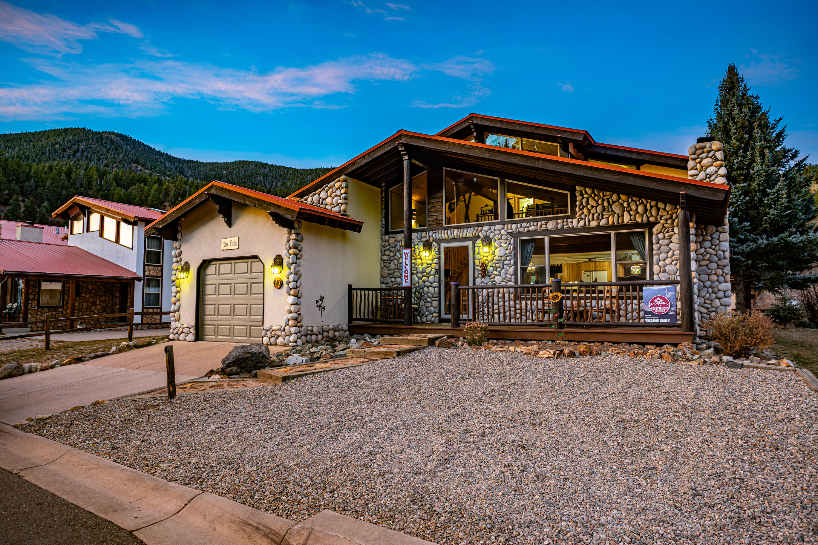 Nestled in the heart of Red River, this stunning mountain home offers the perfect blend of convenience and serenity. Just minutes away from the Ski slopes and vibrant downtown, you'll have easy access to charming shops, delightful restaurants, and exciting outdoor activities. This cozy haven has breathtaking views of the river as it passes by, allowing you to relax and unwind. With a warm and inviting interior, the home comes fully furnished, has a spacious living area with large windows- capturing the mountain views, and a well-appointed kitchen perfect for entertaining. If you're enjoying a morning coffee on the deck, taking in the stunning scenery, or gathering around the fireplace after a day on the slopes, this home is designed for those who appreciate the beauty of mountain living.