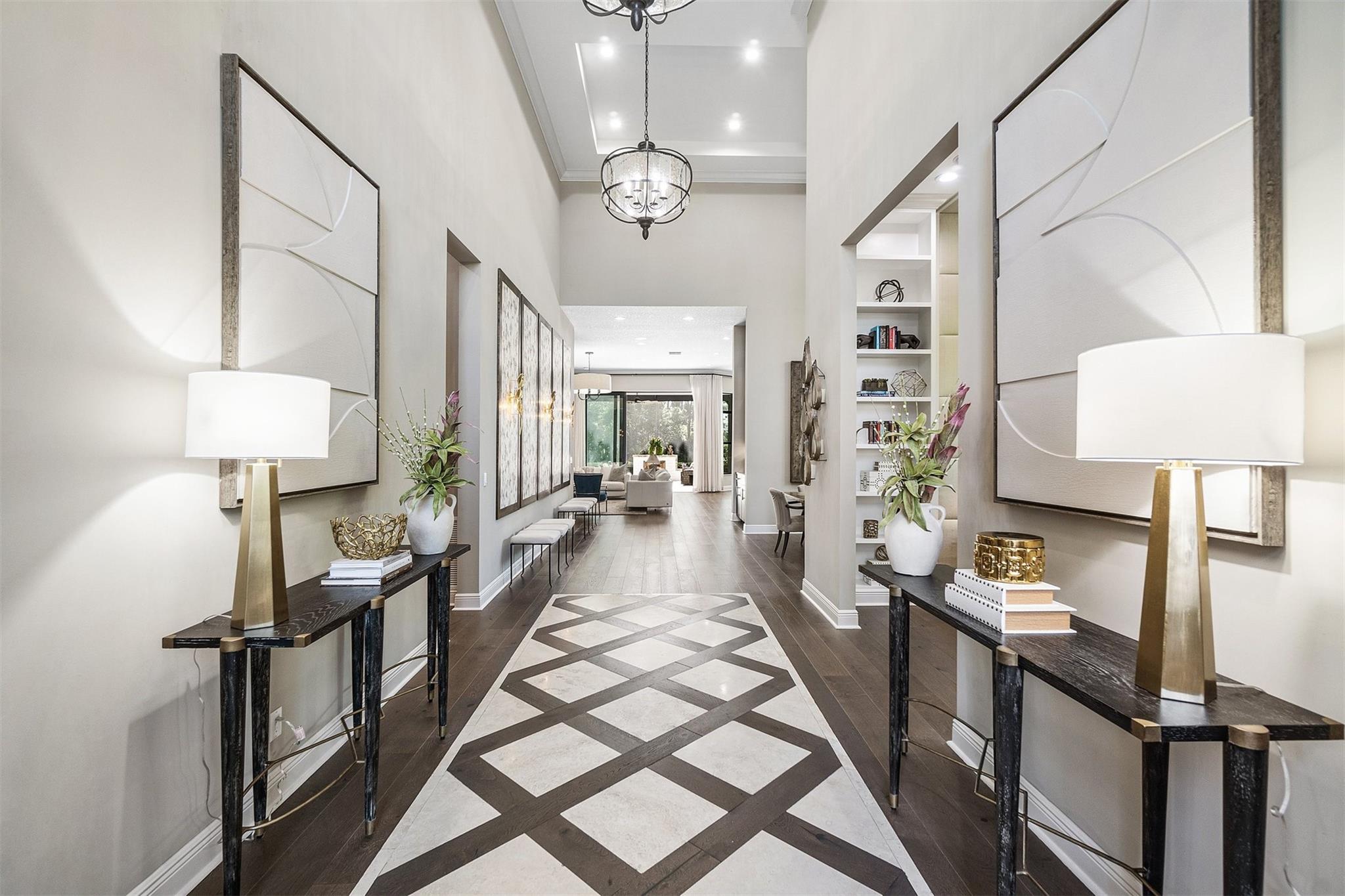 Offered Fully furnished and accessorized. Welcome to 1046 Faulkner Terrace - where designer upgrades, high end furnishings create a unique and elevated Florida lifestyle 

This former builder’s model stuns at every turn with over 2,800 sq ft of expertly curated interiors on a private preserve and corner lot. From the travertine-inlaid foyer with a beamed 19.5-foot ceiling, no detail was overlooked. The gourmet kitchen features a dramatic waterfall island, double-stacked KitchenCraft cabinetry with glass uppers and puck lighting, GE Profile appliances, and a pot filler over the 30" gas cooktop. Entertain effortlessly with a spacious great room and built-in wet bar, complete with undercounter wine fridge and ice maker. Enjoy a seamless indoor-outdoor flow to the 1,100 sq ft screened lanai, featuring travertine pavers, a full summer kitchen, and a gas-plumbed fireplace.

The owner’s suite is a true retreat, featuring engineered wood floors, designer lighting, motorized shades, and custom drapes. A spa-worthy bathroom awaits with a beach-entry shower and travertine tile and vessel sinks.

Each secondary bedroom is en-suite with walk-in closets and brand new carpet and padding. 

 The den offers a dramatic built-in waterfall quartz desk, floor-to-ceiling built-in bookshelves, and elegant ceiling and wall paneling.

Additional highlights include impact glass, an in-ceiling speaker system, a built-in drop zone, a custom great room entertainment center with a travertine backsplash, landscape lighting, a freshly painted exterior, and a 3-car garage with dual driveways.

Located in Alton’s walkable community with access to dining, shopping, and top-rated schools. Offered fully furnished - including TVs, art, drapery, and patio pieces - for a truly move-in-ready lifestyle.

Experience model home living at its finest - schedule your private tour today.