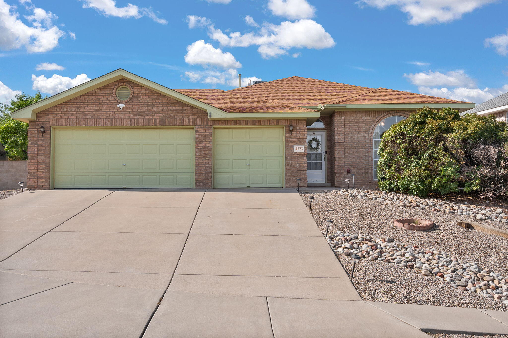 Beautiful and bright NW gem! This Oppenheimer Jenkins home sits perfectly on a corner lot in a prime location, featuring a 3-car garage and no HOA. A functional floor plan, raised ceilings, and skylights create a wonderfully open, airy feel. The sellers have thoughtfully updated the home with both style and utility in mind, including a remodeled kitchen, newer AC, peel-and-stick accent walls, and a brand-new dishwasher. Step outside to a backyard oasis with lush grass, garden beds, fruit trees, ornamental plants, irrigation, and a spacious shed. Truly a must-see!