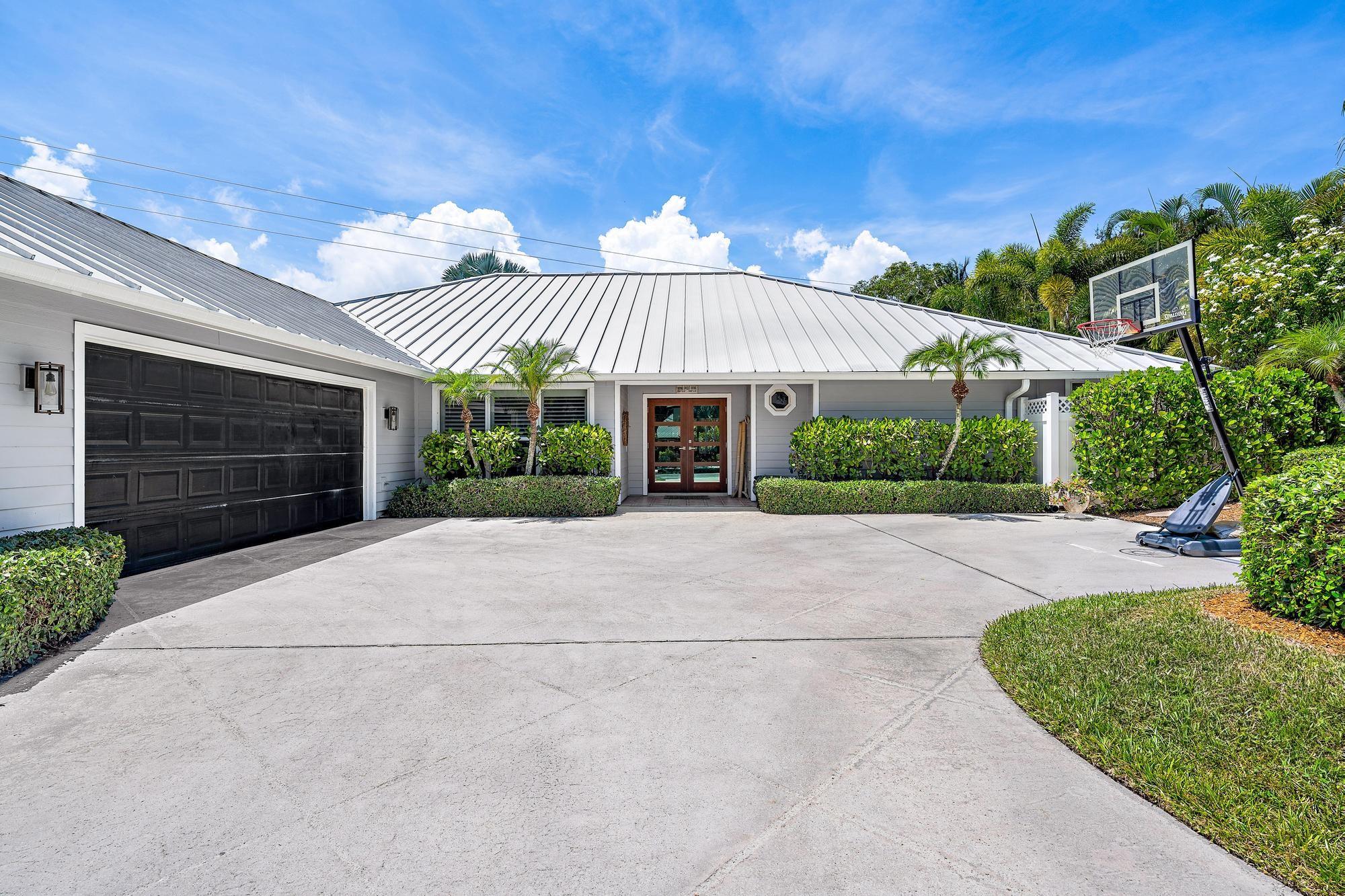 Welcome to your dream oasis in Frenchmen’s Cove. This 3,507 sq ft residence blends luxury and comfort on a private, tree-lined lot. Featuring 4 spacious bedrooms, 3.5 baths, an updated chef’s kitchen with a Sub-Zero refrigerator, and an office off the primary suite plus an upstairs bonus room, it offers versatile living. The 4th bedroom would be the perfect in-law suite, with its own private entrance, potentially separating from the rest of the house. A metal roof and impact windows ensure beauty and durability. Outdoors, enjoy the sparkling saltwater pool, pergola, and lush surroundings—perfect for relaxing or entertaining. Experience this exceptional home where sophistication meets warmth.